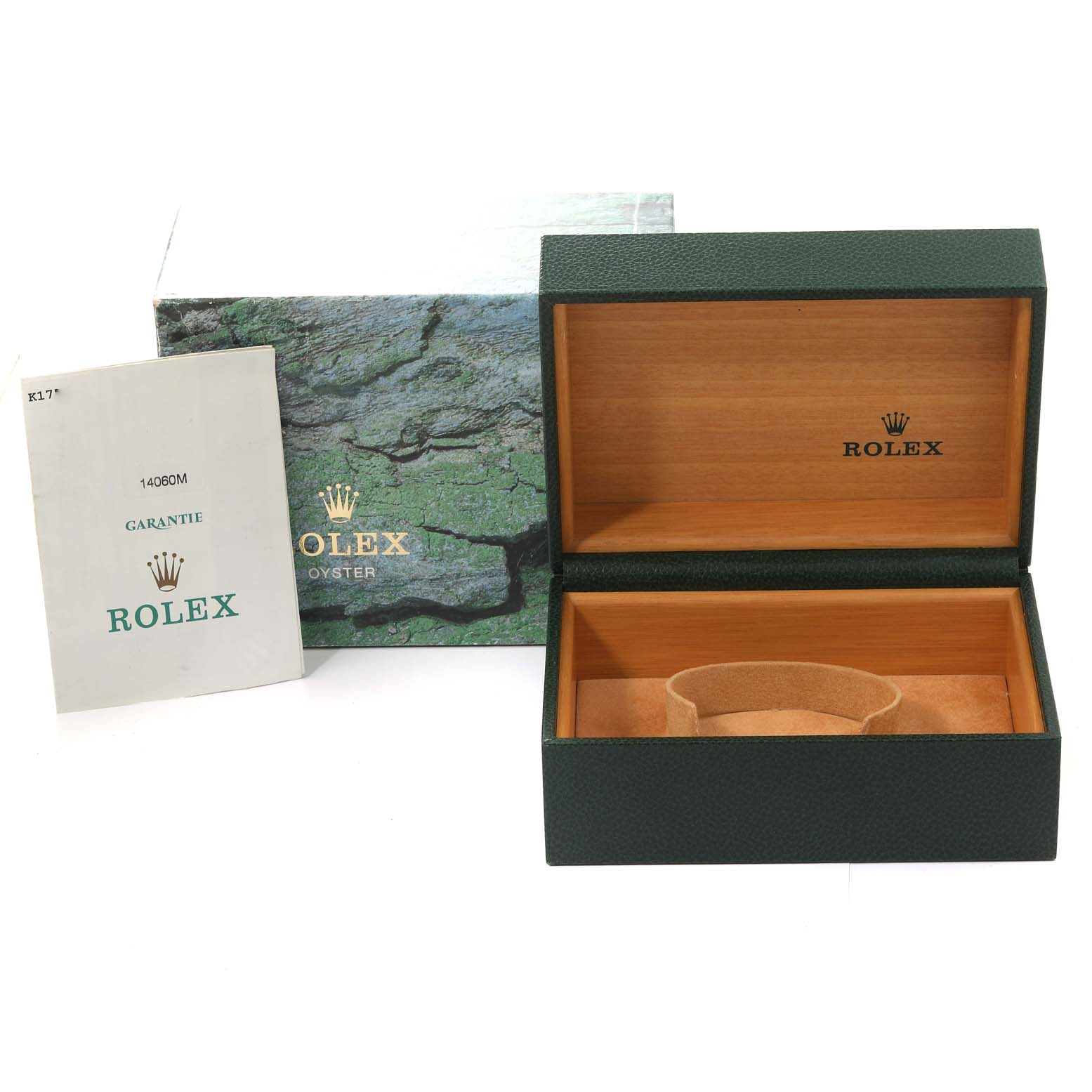 The image shows the packaging and accessories for a Rolex Submariner 14060 Men
s Stainless Steel Black Dial 14060 Men
s Stainless Steel Black Dial, including a green box with a tan interior and a warranty booklet.