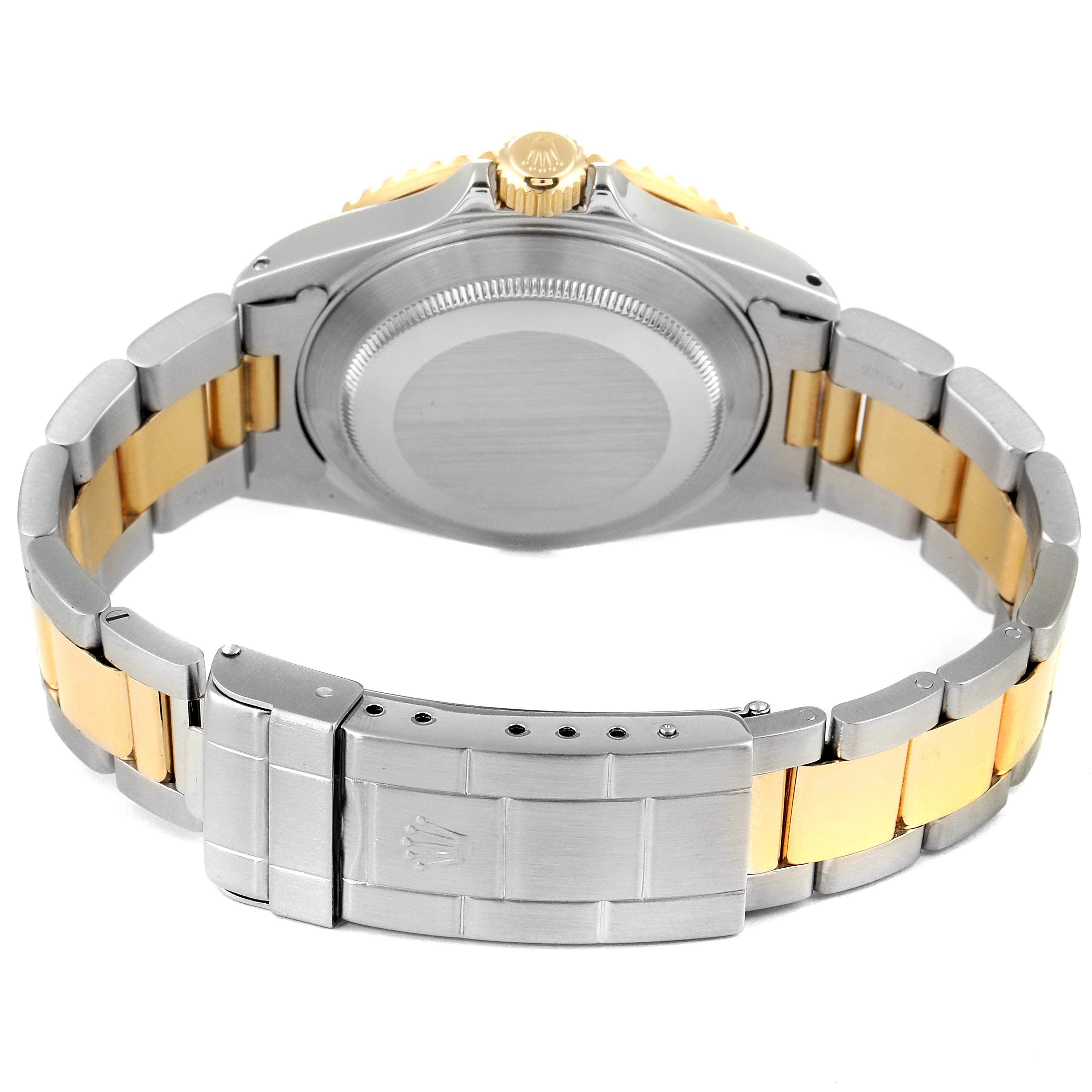 This image shows the back case and clasp of a Rolex Submariner 16613 Men
s Steel and Gold (two tone) Blue Dial 16613 Men
s Steel and Gold (two tone) Blue Dial watch, featuring a two-tone metal bracelet.