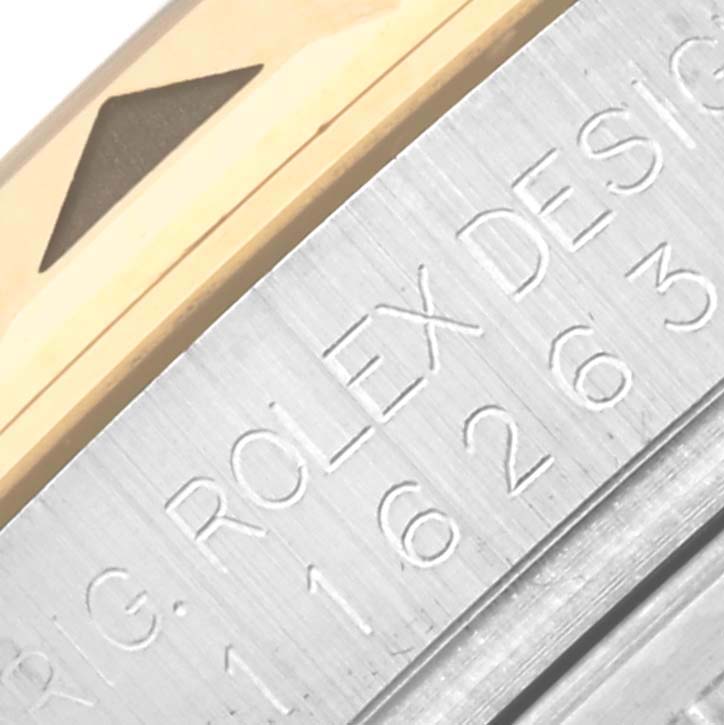 The image shows a close-up of the bezel and engraved edge of a Rolex Turn-o-Graph 116263 Men
s Steel and Gold (two tone) Grey Dial 116263 Men
s Steel and Gold (two tone) Grey Dial watch.