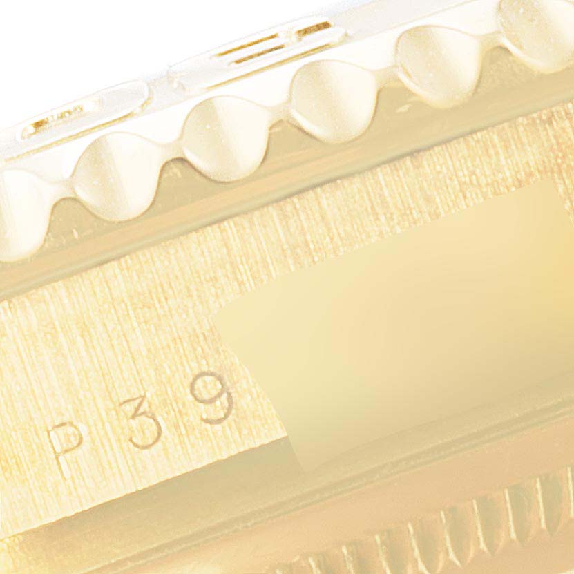 This close-up image shows the side detail and serial number section of a Rolex Yacht-Master 16628 Men's Yellow Gold White Dial 16628 Men's Yellow Gold White Dial watch case.