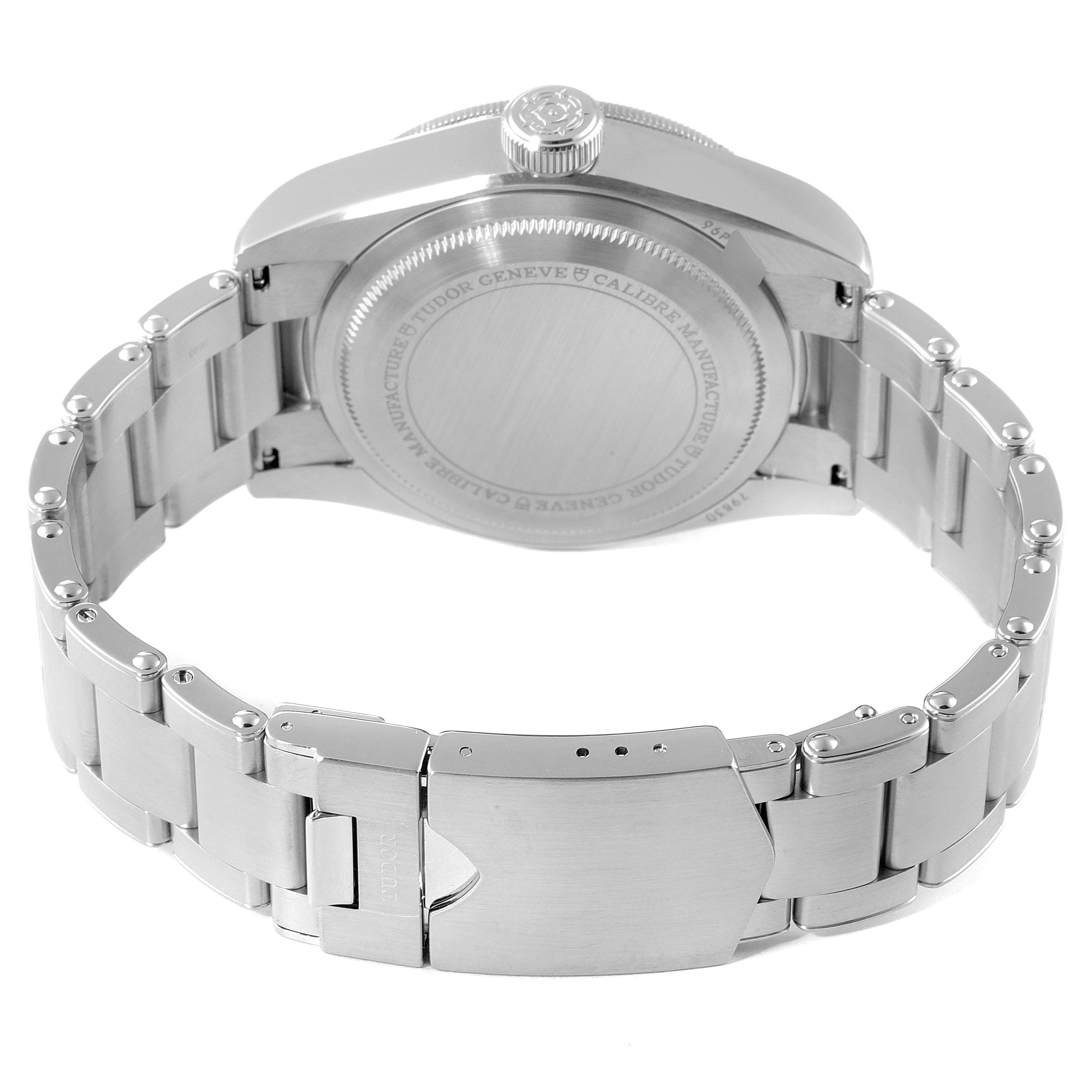 The image shows the back and clasp of a Tudor Heritage Black Bay 79830RB Men's Stainless Steel Black Dial 79830RB Men's Stainless Steel Black Dial watch, focusing on the stainless steel bracelet and case back.