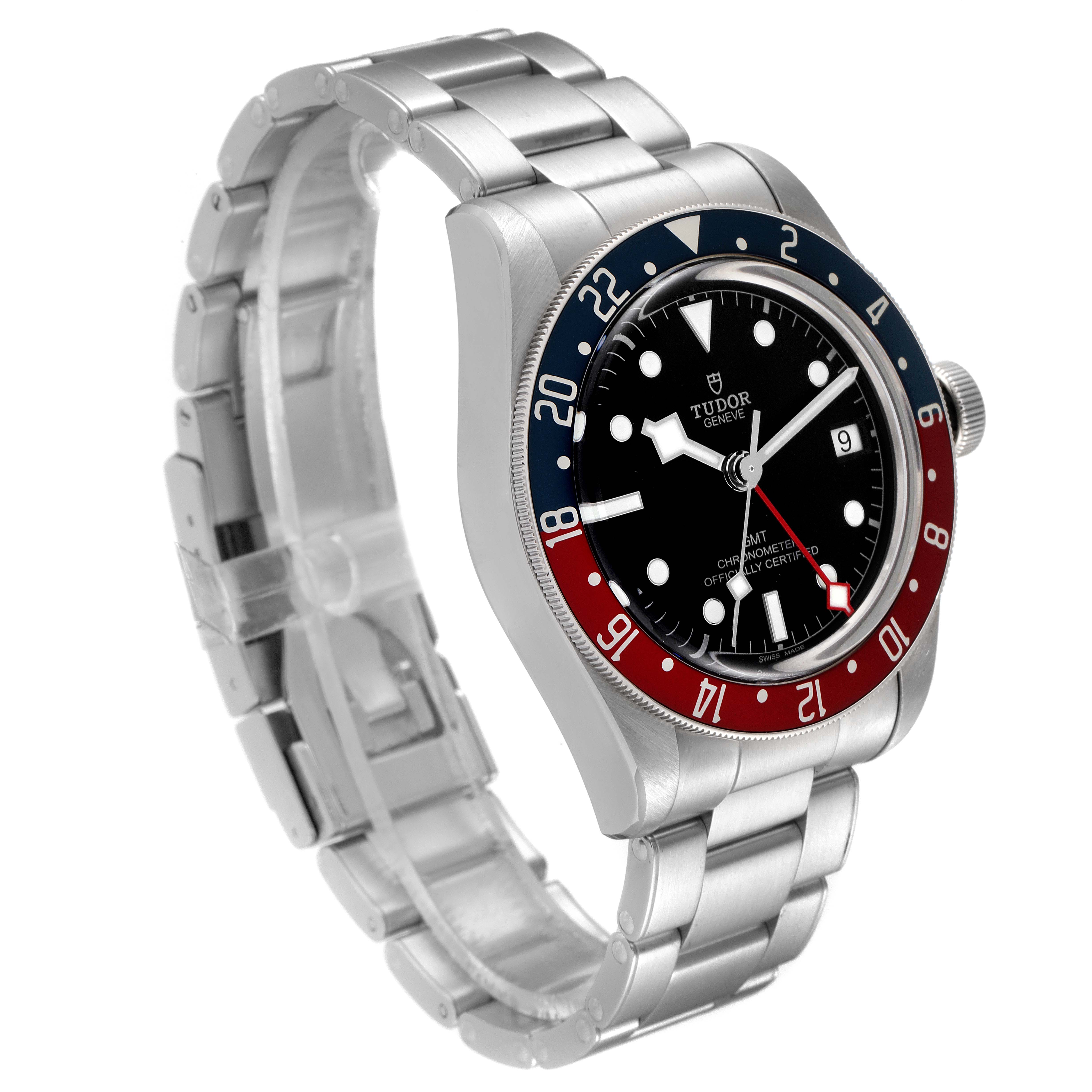 The image shows a Heritage Black Bay watch by Tudor at a three-quarter angle, highlighting its bezel, dial, and bracelet.