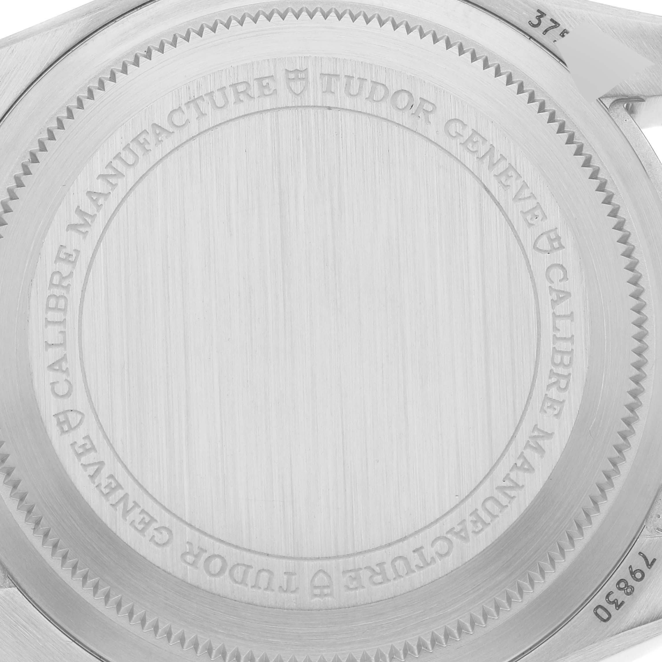 This image shows the back casing of the Tudor Heritage Black Bay 79830RB Men
s Stainless Steel Black Dial 79830RB Men
s Stainless Steel Black Dial watch, displaying its engravings and brushed metal finish.