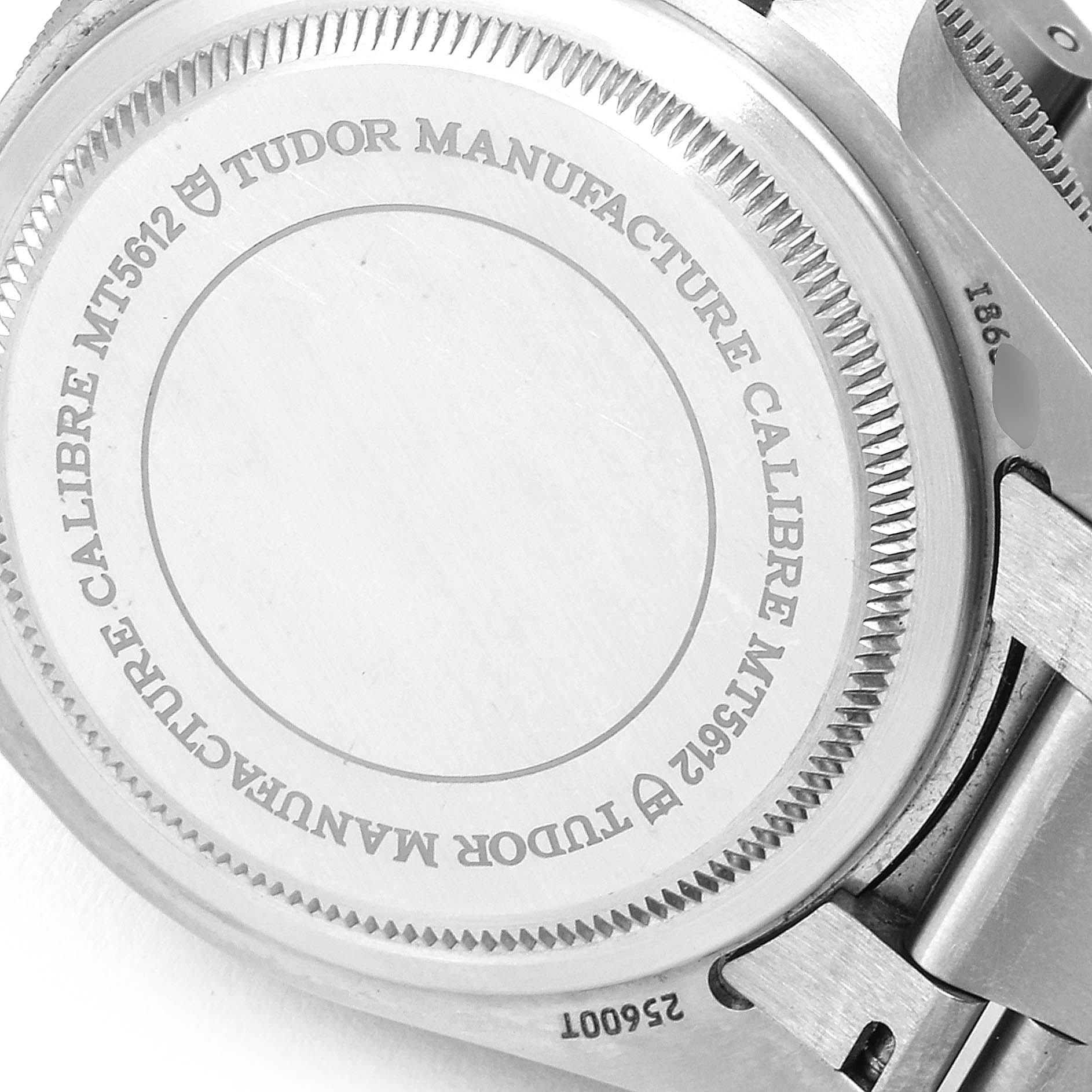 This image shows a close-up of the case back for the Tudor Pelagos 25500TN Men's Titanium Black Dial 25500TN Men's Titanium Black Dial watch, highlighting its branding and serial number.