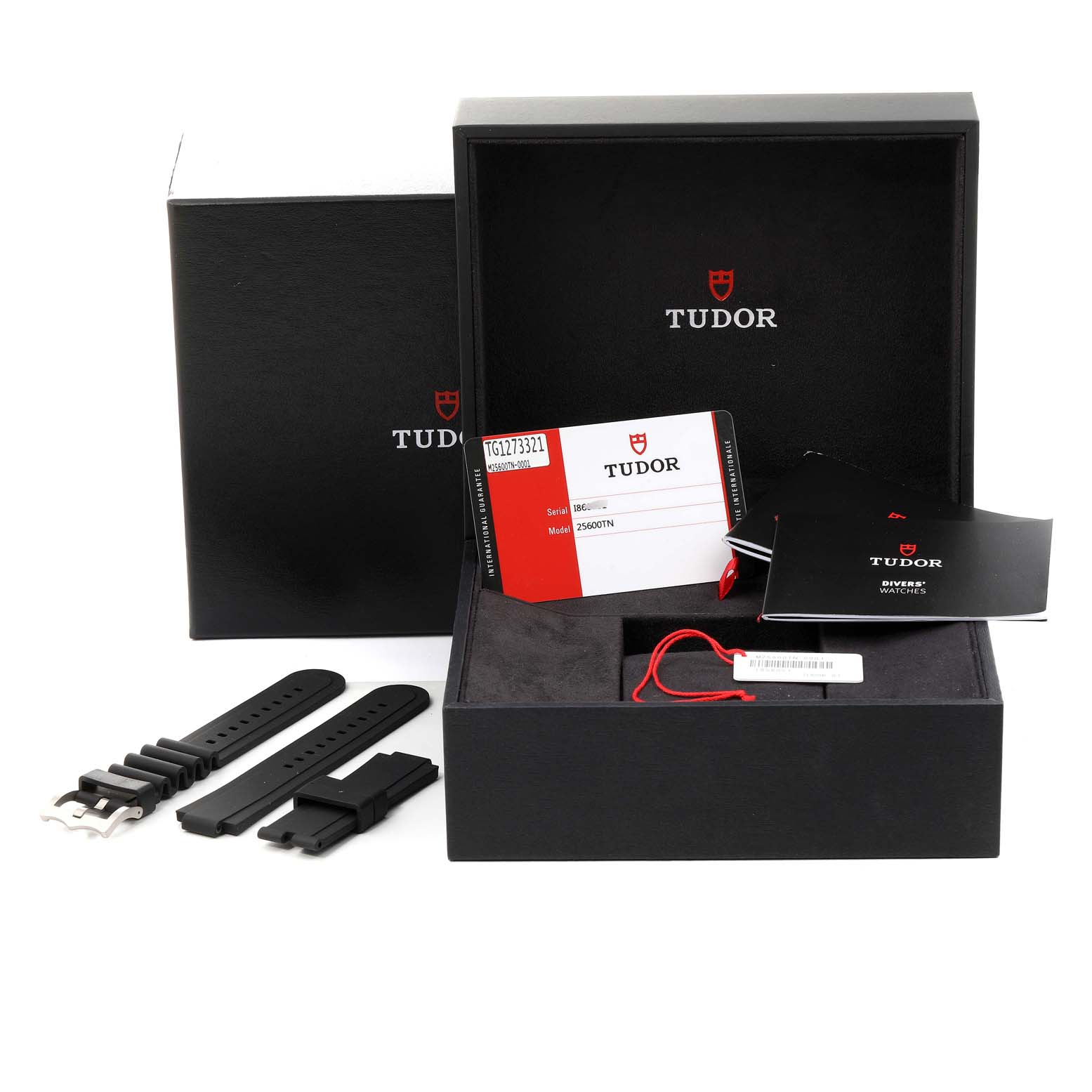 The image shows the packaging, warranty card, booklets, and additional straps of the Tudor Pelagos 25500TN Men's Titanium Black Dial 25500TN Men's Titanium Black Dial watch.