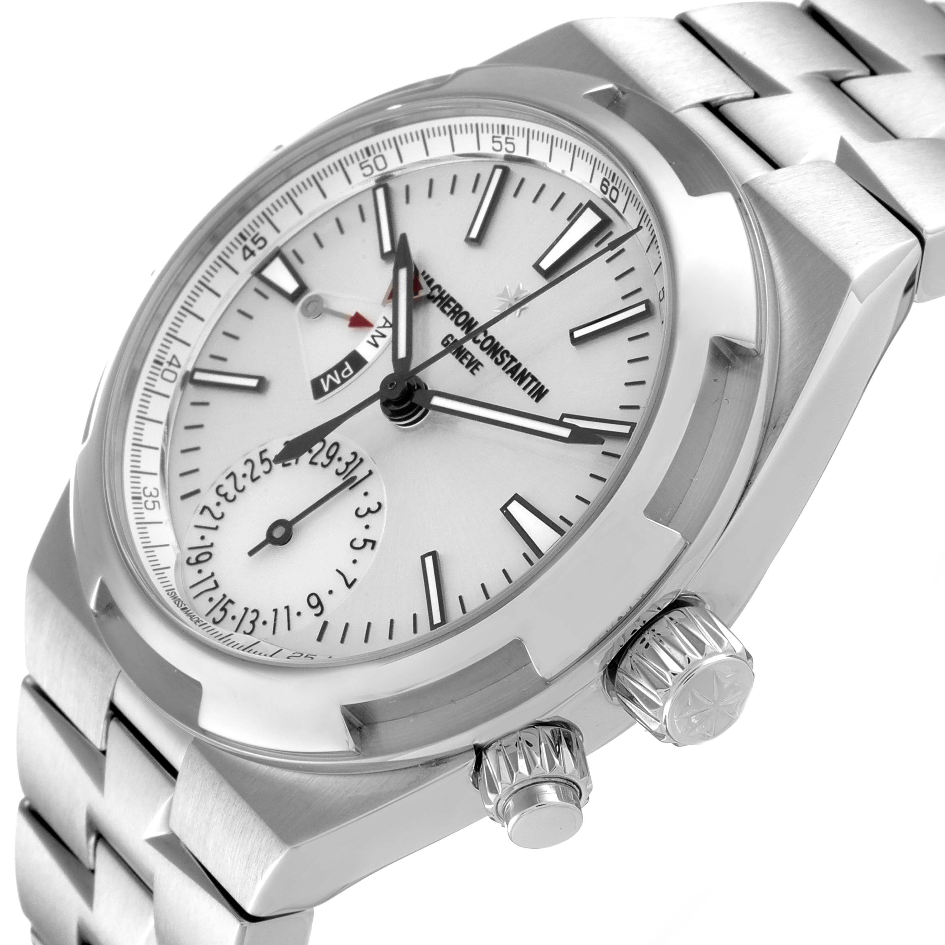 The image shows a Vacheron Constantin Overseas 7900V/110A-B333 Men's Stainless Steel Silver Dial 7900V/110A-B333 Men's Stainless Steel Silver Dial watch at an angled close-up, highlighting the face, crown, and a portion of the bracelet.