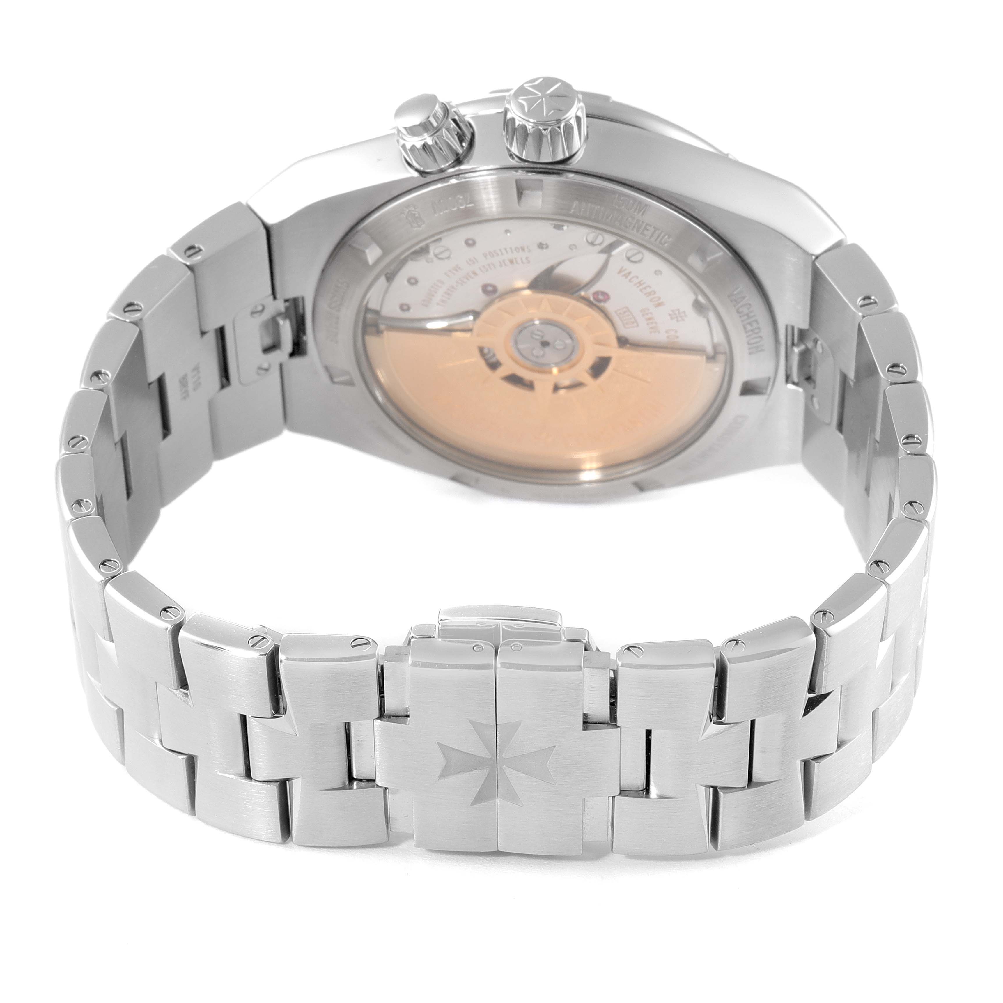 The image shows the back view of the Vacheron Constantin Overseas 7900V/110A-B333 Men's Stainless Steel Silver Dial 7900V/110A-B333 Men's Stainless Steel Silver Dial watch displaying its movement and bracelet clasp.