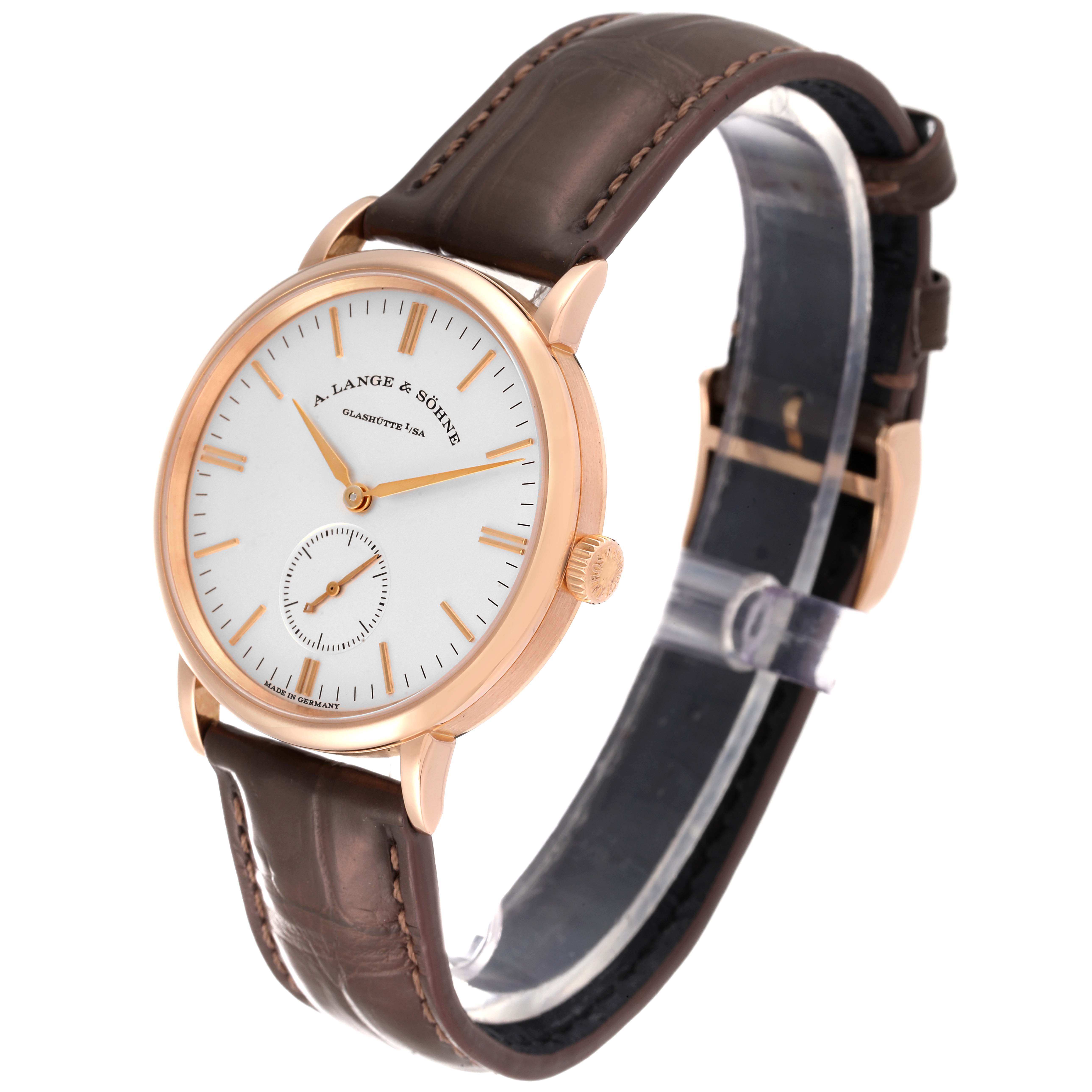 The A. Lange & Sohne Saxonia watch is shown at an angle displaying the face, crown, and leather strap.