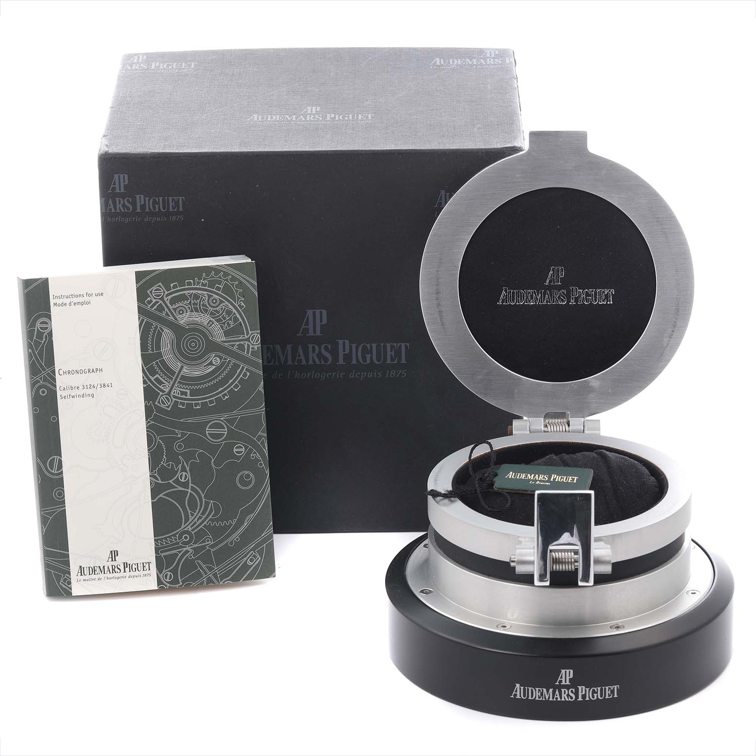 The image shows the Audemars Piguet Jules 26558TI.OO.D080VE.01 Men's Titanium Grey Dial 26558TI.OO.D080VE.01 Men's Titanium Grey Dial model packaging and box from a frontal angle, including a booklet and open display case.