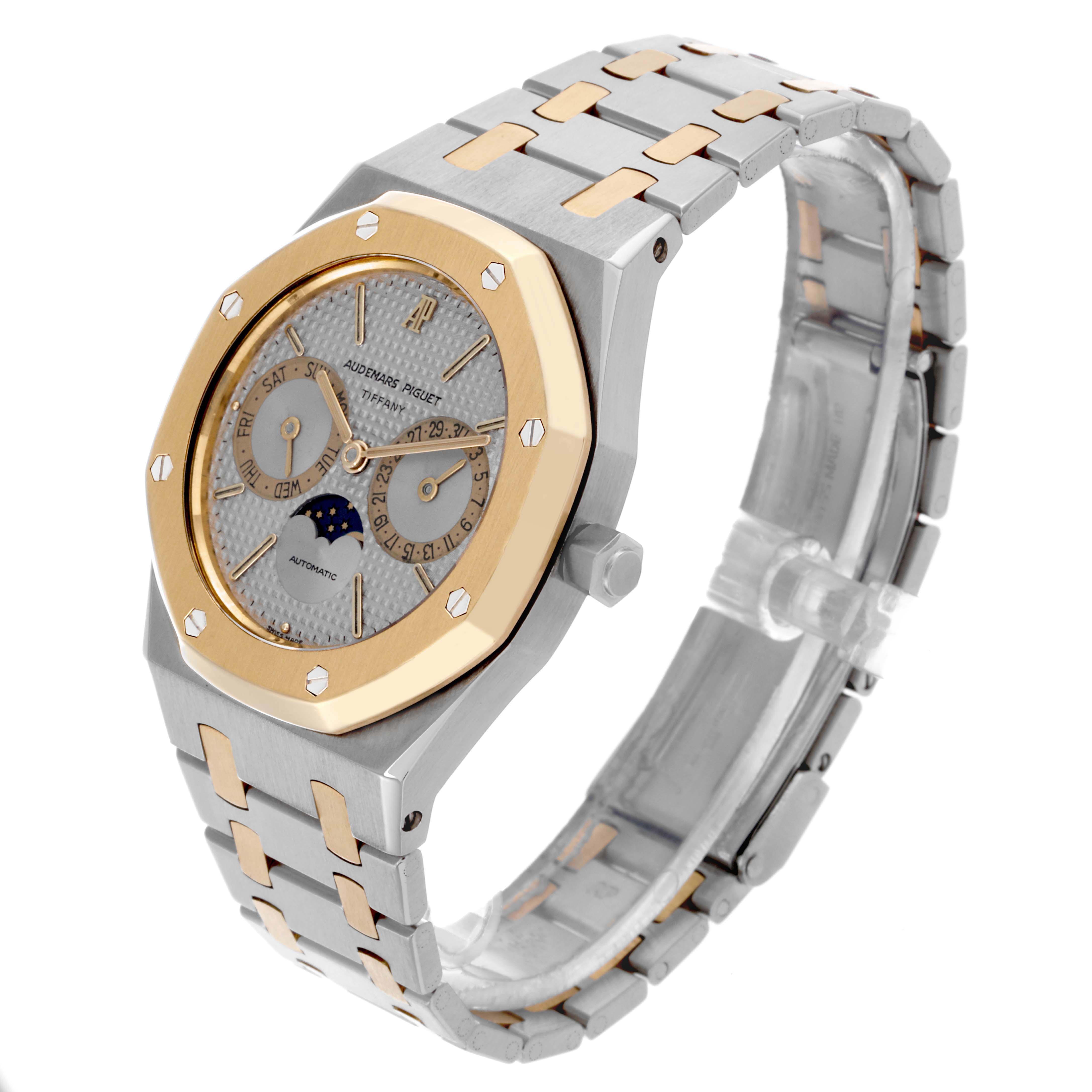 The Audemars Piguet Royal Oak 25594SA Men's Steel and Gold (two tone) Silver Dial 25594SA Men's Steel and Gold (two tone) Silver Dial watch is shown at a three-quarter angle, highlighting the case, bracelet, and bezel.