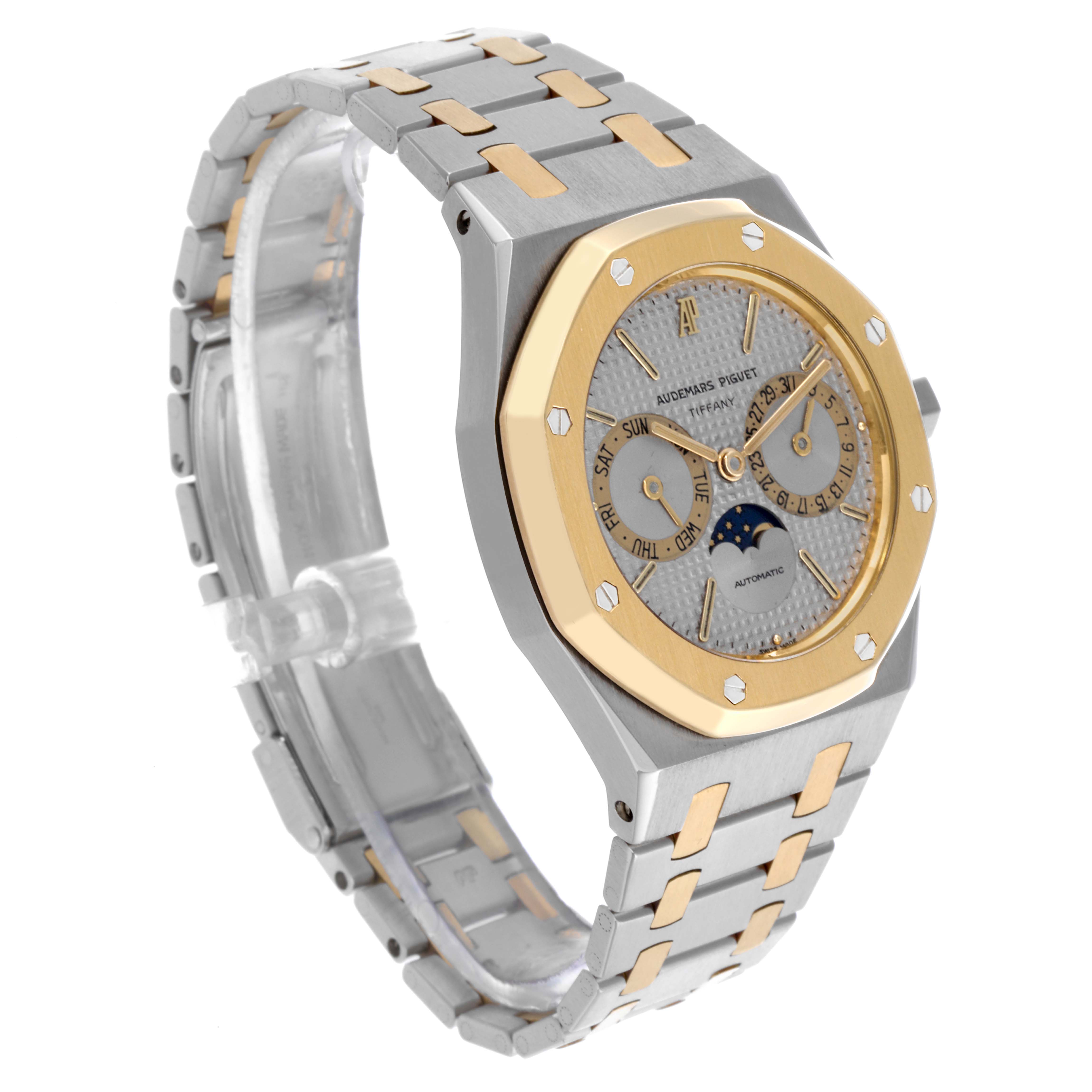 The Audemars Piguet Royal Oak 25594SA Men's Steel and Gold (two tone) Silver Dial 25594SA Men's Steel and Gold (two tone) Silver Dial watch is shown at a three-quarter angle, displaying the face, bezel, and bracelet.