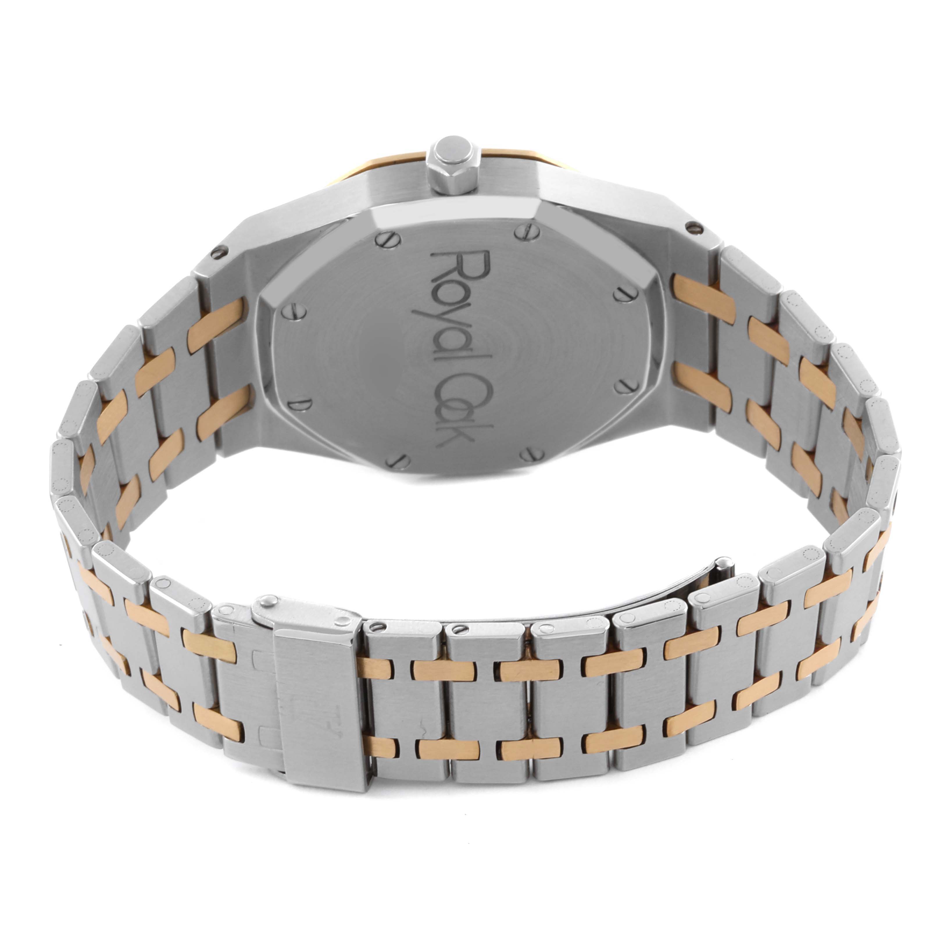 The image shows the back and bracelet of an Audemars Piguet Royal Oak 25594SA Men's Steel and Gold (two tone) Silver Dial 25594SA Men's Steel and Gold (two tone) Silver Dial watch, highlighting its two-tone metal links.