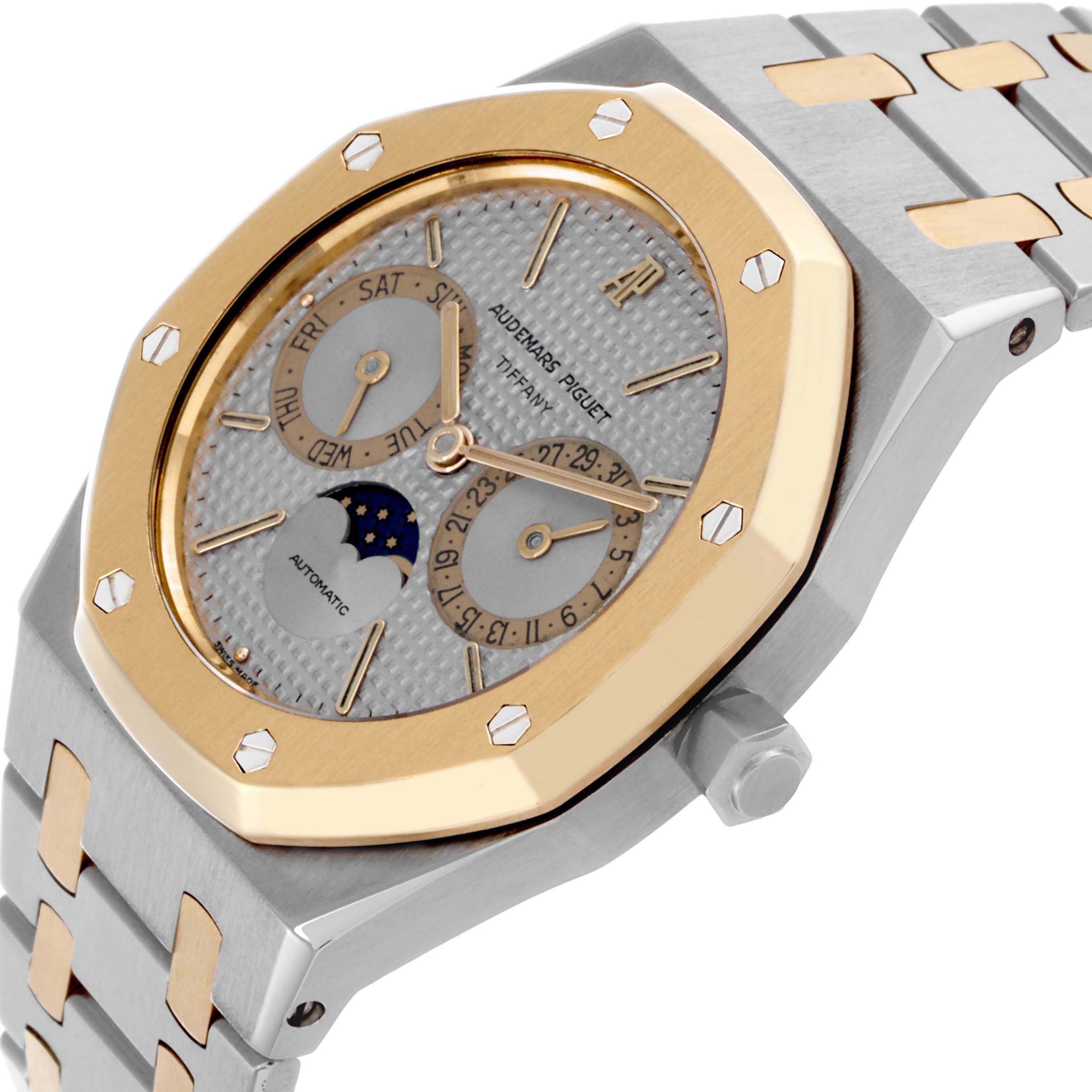 The image shows a side angle of the Audemars Piguet Royal Oak 25594SA Men's Steel and Gold (two tone) Silver Dial 25594SA Men's Steel and Gold (two tone) Silver Dial watch, highlighting its bezel, dial, and bracelet.