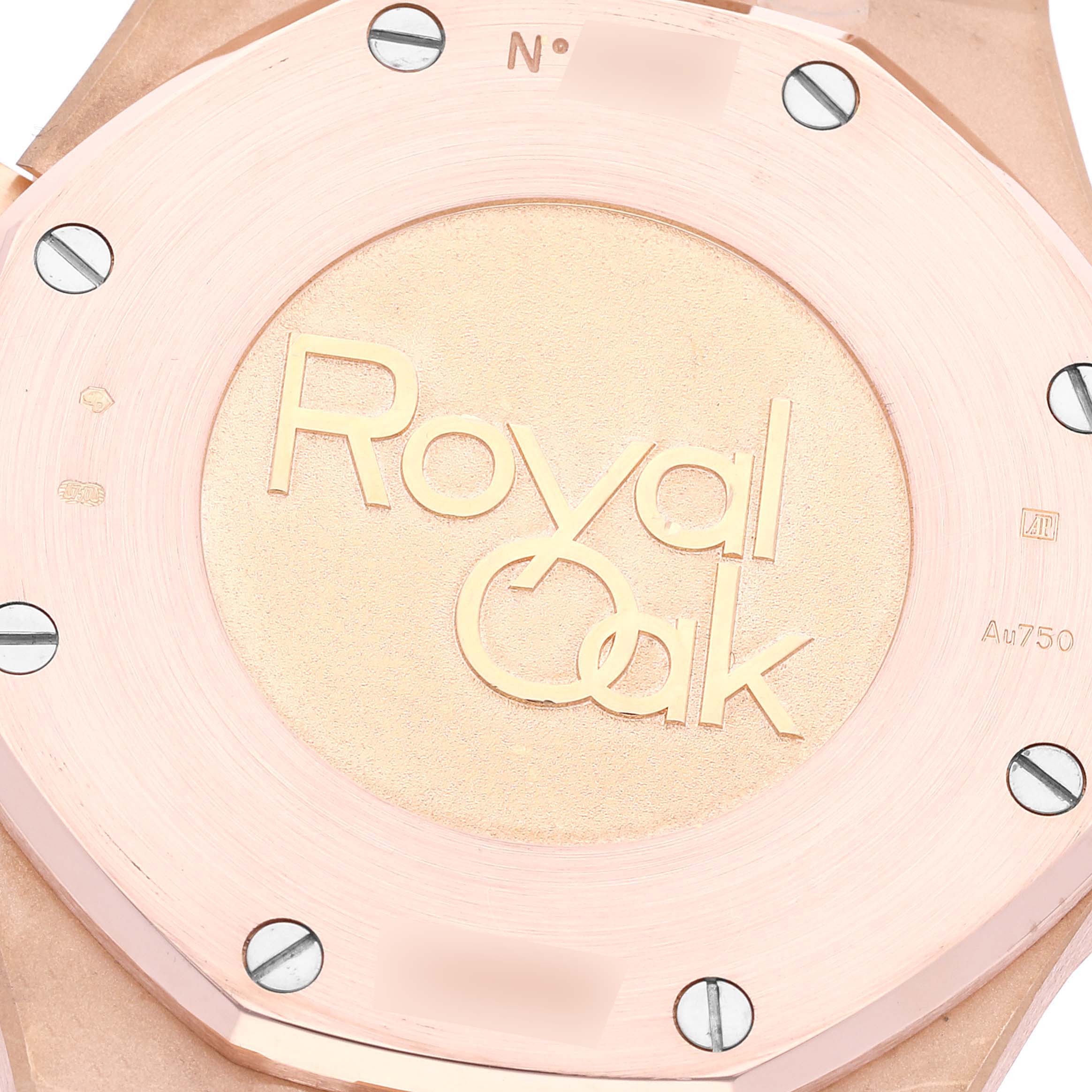 This image shows the back of the Audemars Piguet Royal Oak 26320OR.OO.D088CR.01 Men's Rose Gold Silver Dial 26320OR.OO.D088CR.01 Men's Rose Gold Silver Dial watch, focusing on the engraved case and surrounding screws.