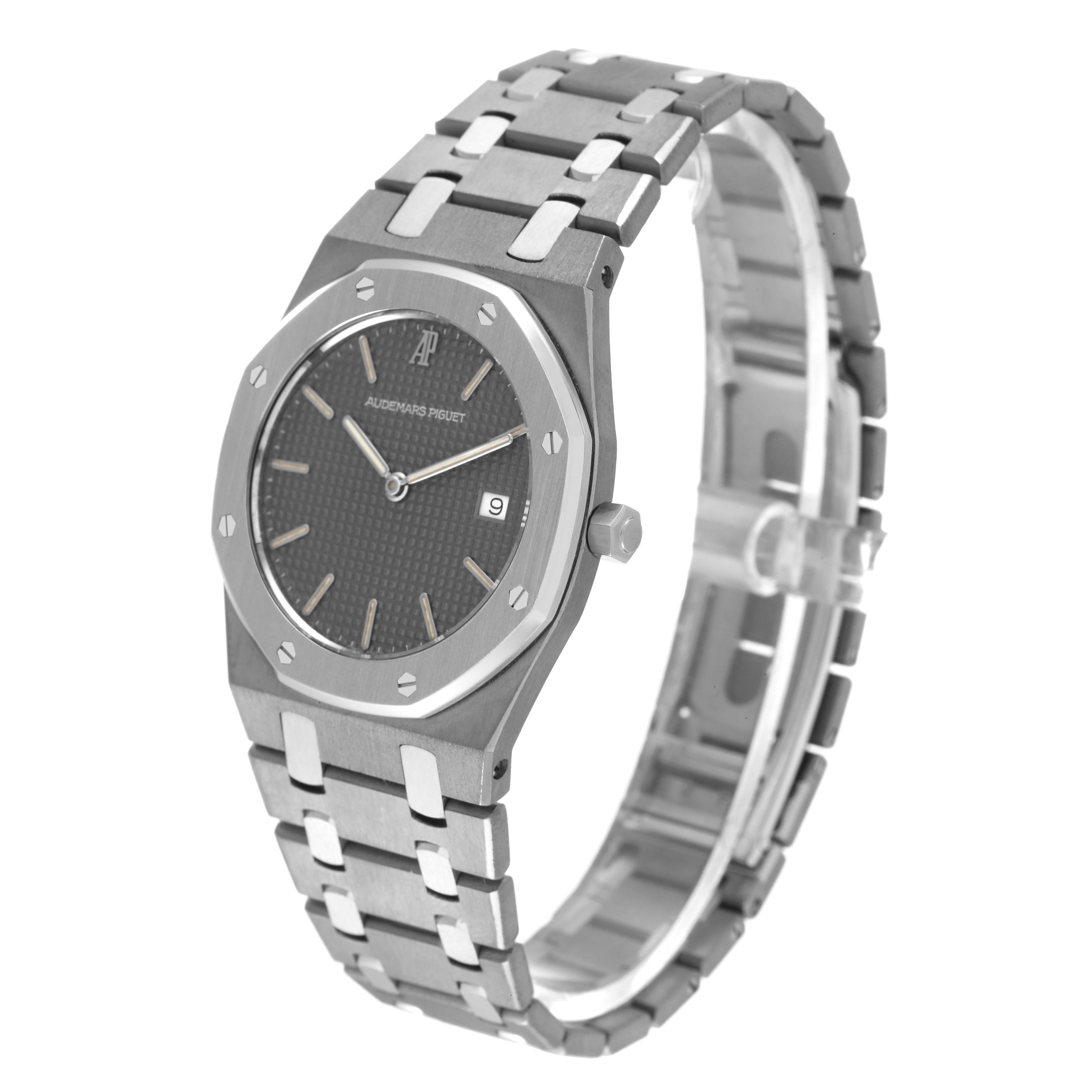 The image shows a side angle of the Audemars Piguet Royal Oak 56175TT Men's Stainless Steel Grey Dial 56175TT Men's Stainless Steel Grey Dial watch, highlighting the dial, bezel, crown, and bracelet.