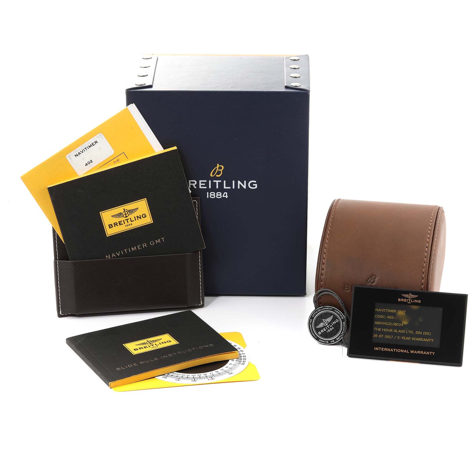 The image shows the Breitling Navitimer AB044121/BD24 Men
s Stainless Steel Black Dial AB044121/BD24 Men
s Stainless Steel Black Dial watch box and accessories, including manuals, warranty card, and a leather case.