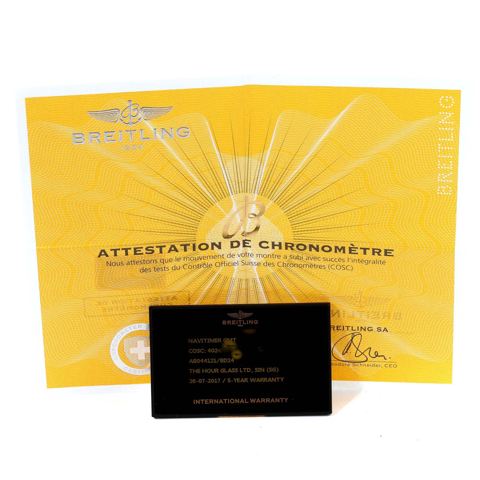 The image shows a front view of the Breitling Navitimer AB044121/BD24 Men
s Stainless Steel Black Dial AB044121/BD24 Men
s Stainless Steel Black Dial watch
s chronometer certificate and warranty card.