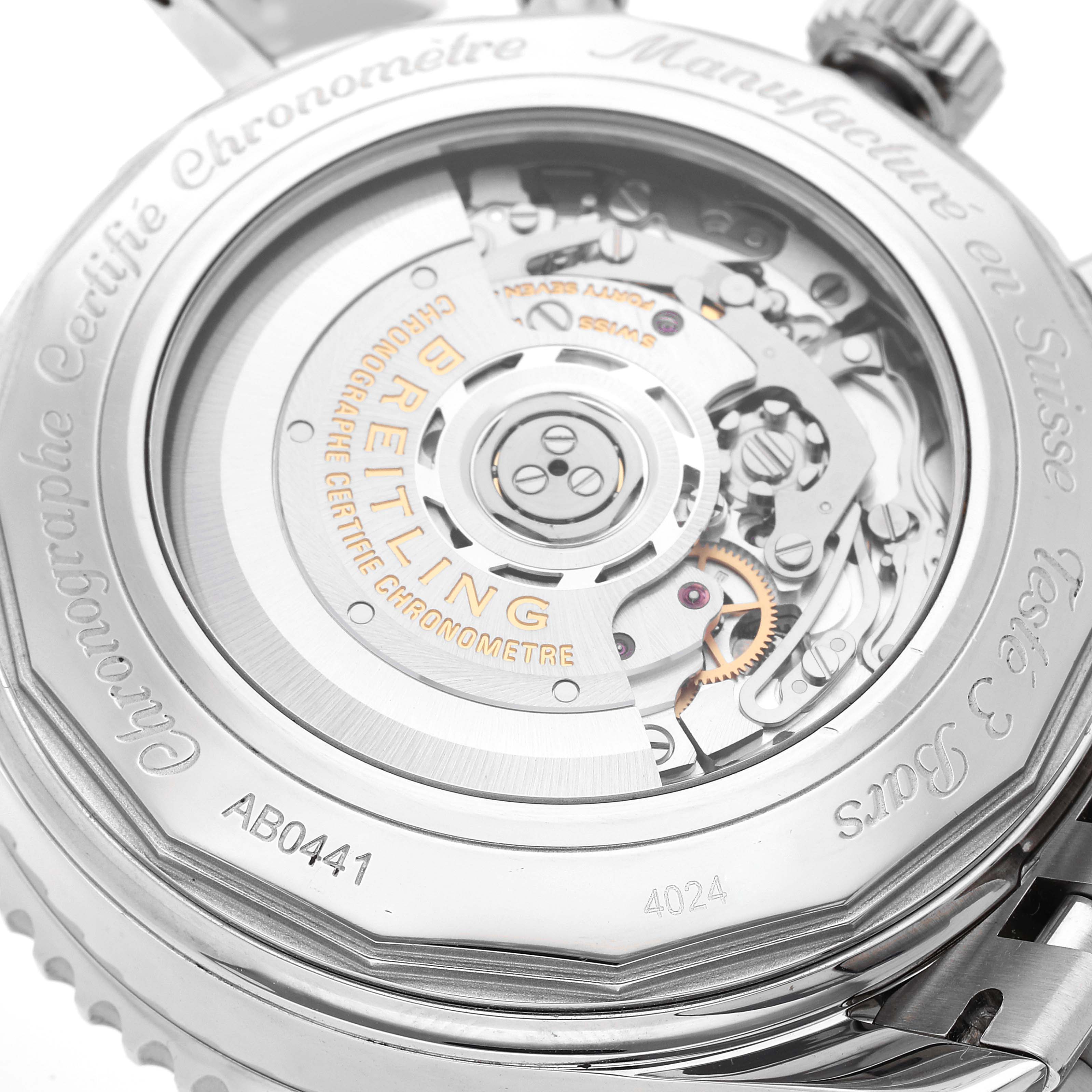 The image shows the back view of the Breitling Navitimer AB044121/BD24 Men
s Stainless Steel Black Dial AB044121/BD24 Men
s Stainless Steel Black Dial watch, displaying its detailed automatic movement and engravings.