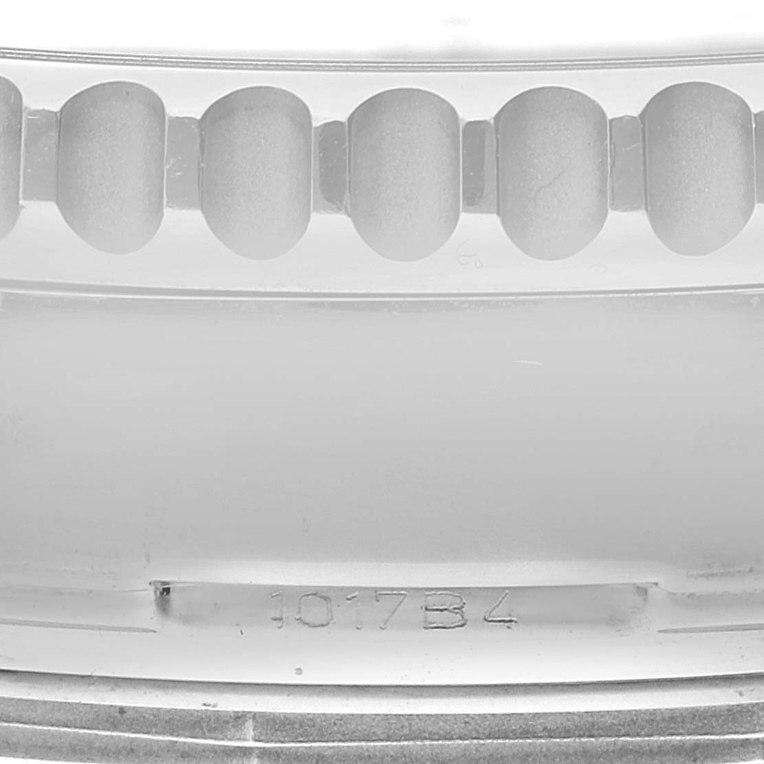 The image shows a close-up view of the bezel teeth and the serial number engraving on a Breitling Navitimer AB044121/BD24 Men
s Stainless Steel Black Dial AB044121/BD24 Men
s Stainless Steel Black Dial watch.