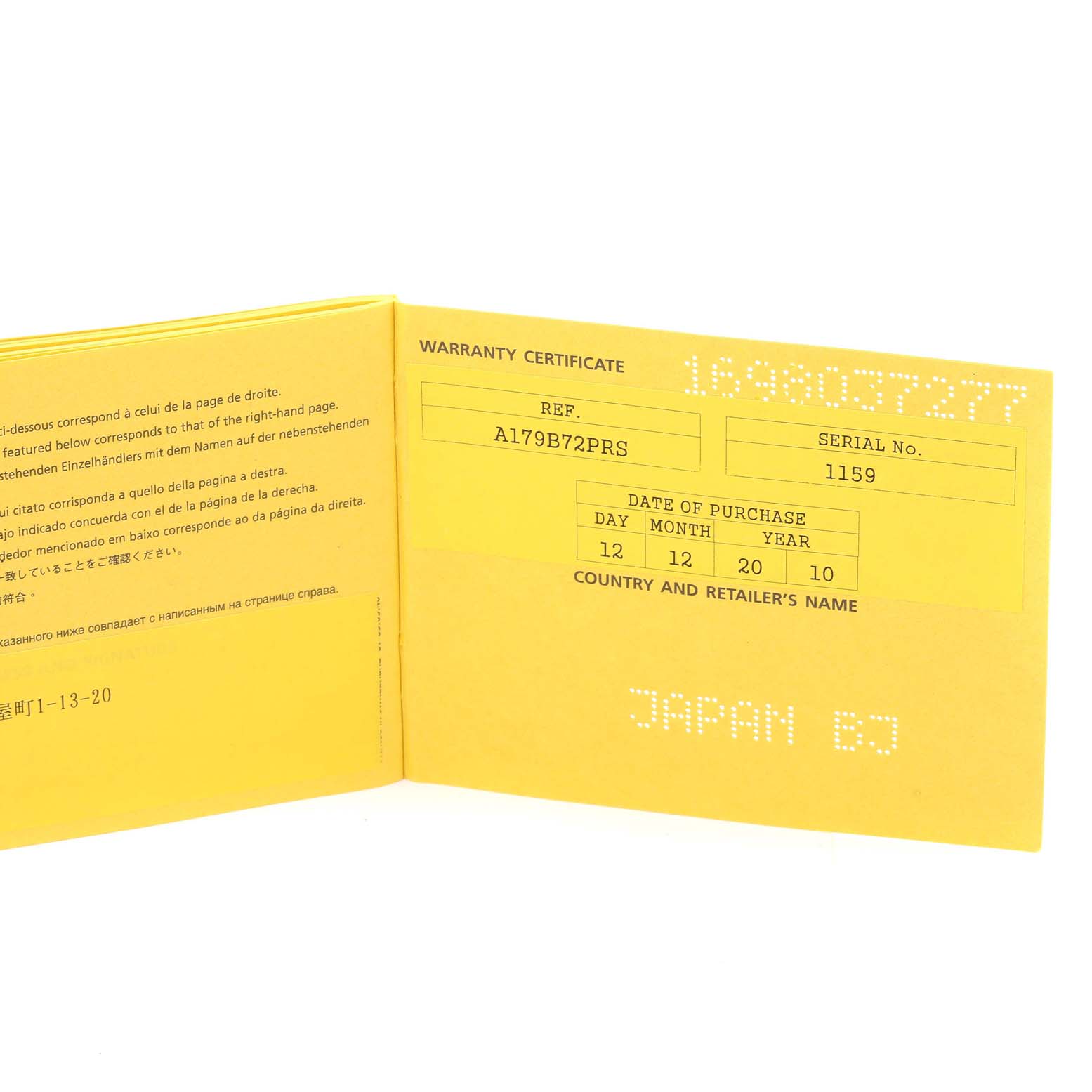 The image shows an open yellow warranty certificate for a Breitling Superocean A17390 Men's Stainless Steel Black Dial A17390 Men's Stainless Steel Black Dial watch, displaying reference and serial numbers.