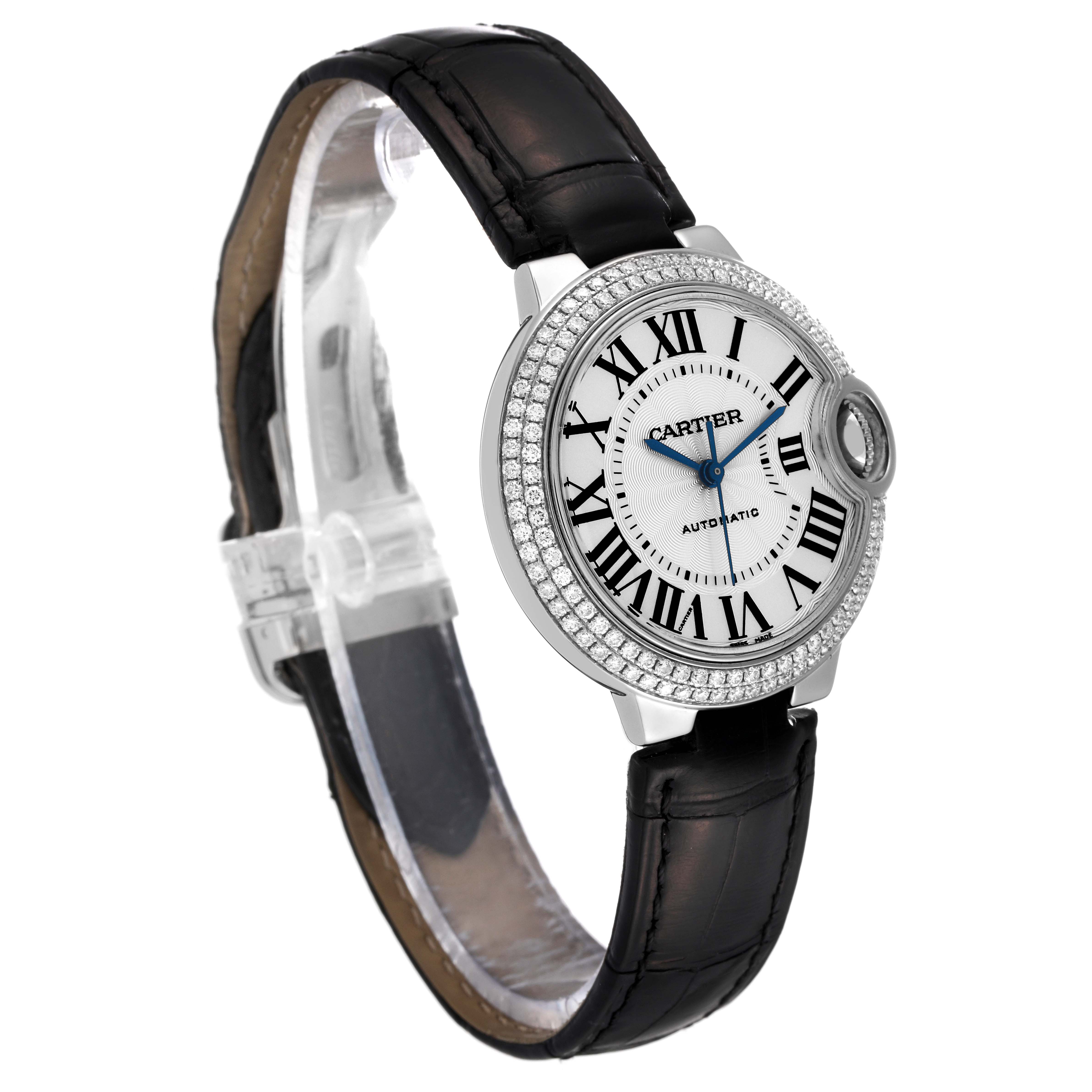 The image shows a Cartier Ballon Bleu WE902067 Women
s White Gold Silver Dial WE902067 Women
s White Gold Silver Dial watch at an angled side view, highlighting its face, diamond bezel, and black leather strap.