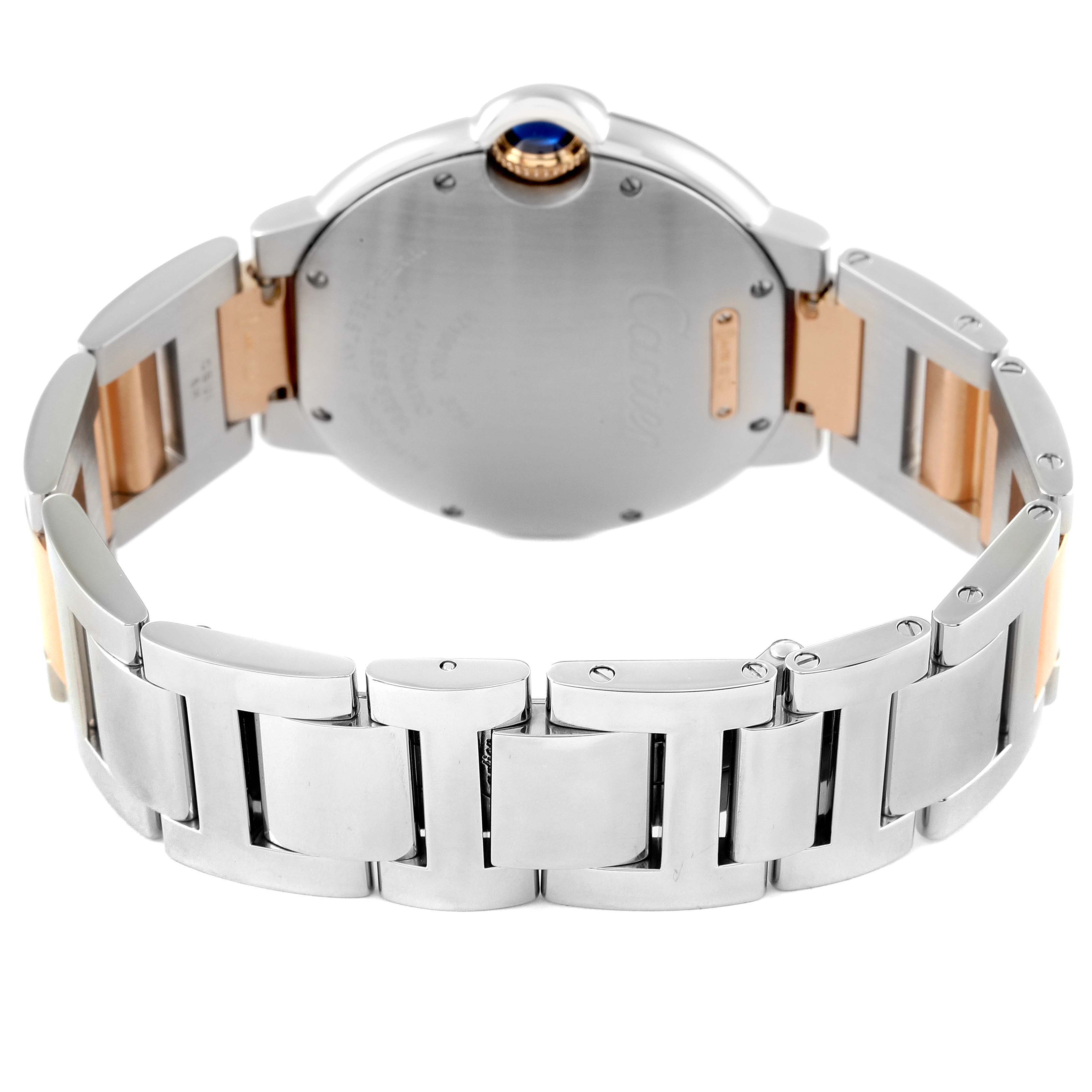 The image shows the back and bracelet of the Cartier Ballon Bleu W3BB0004 Women
s Steel and Gold (two tone) Silver Dial W3BB0004 Women
s Steel and Gold (two tone) Silver Dial watch, highlighting its metal band and clasp.