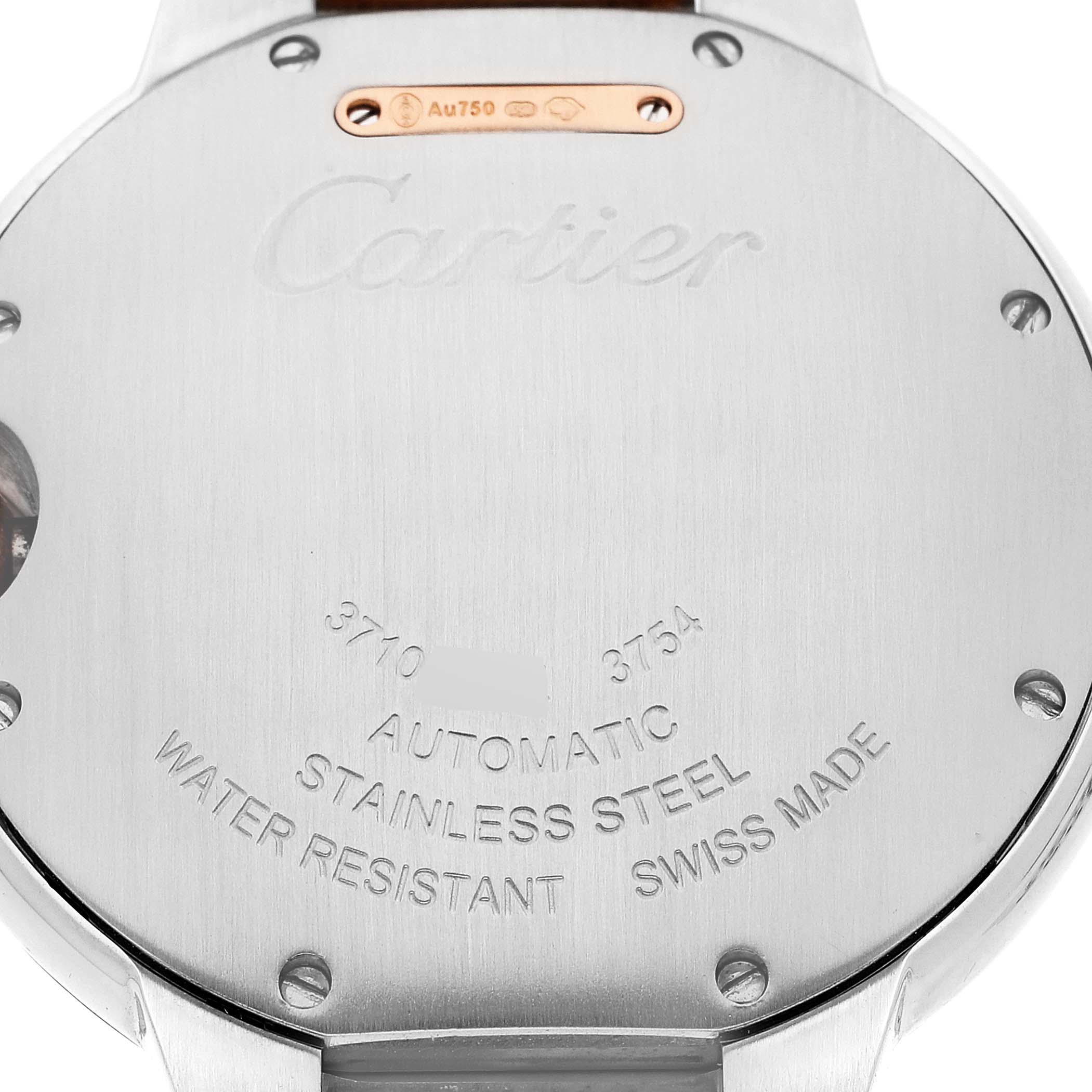 The image shows the back of a Ballon Bleu watch by Cartier, displaying engraved details and specifications.