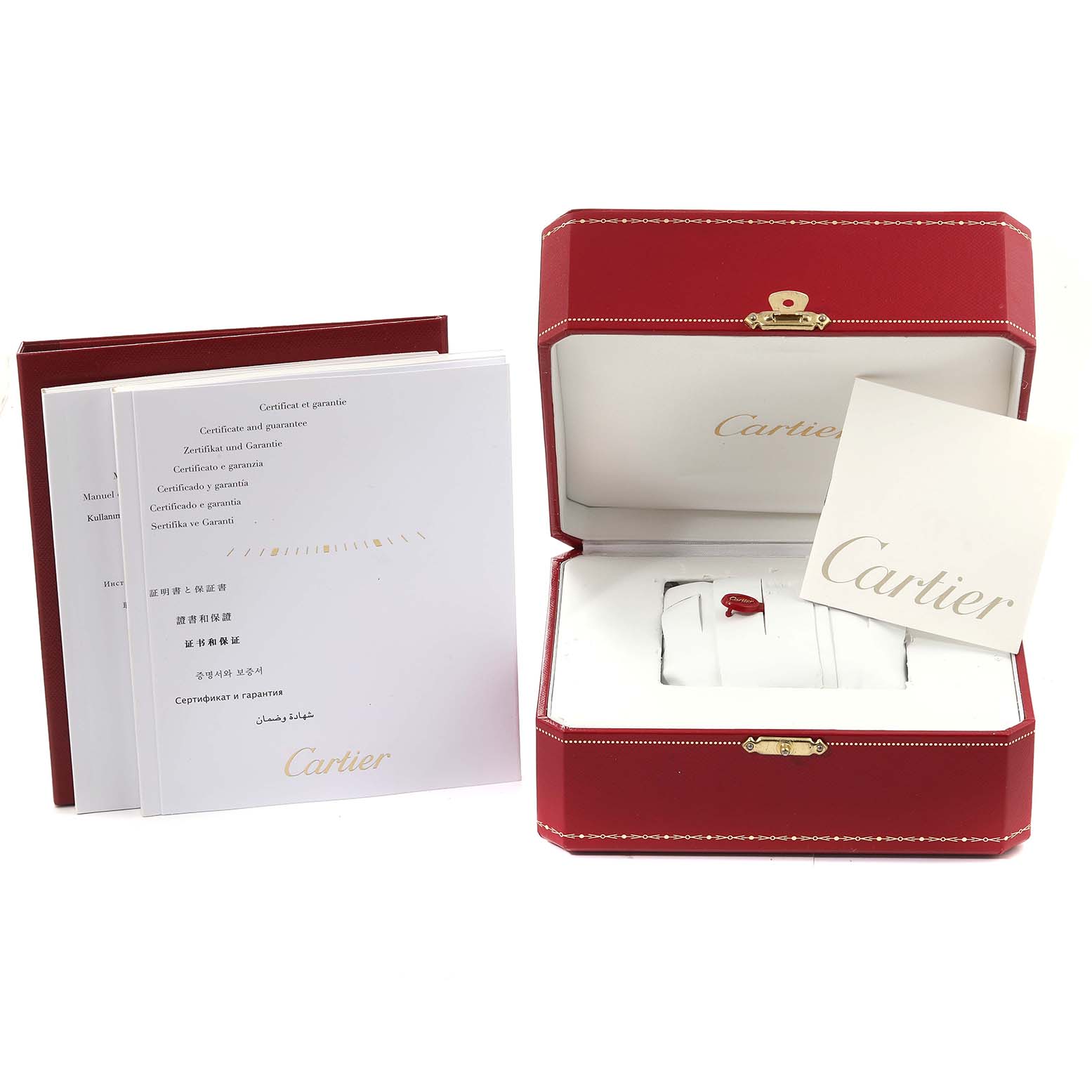 The image shows the packaging, manual, warranty card, and storage box for a Drive de Cartier watch by Cartier.