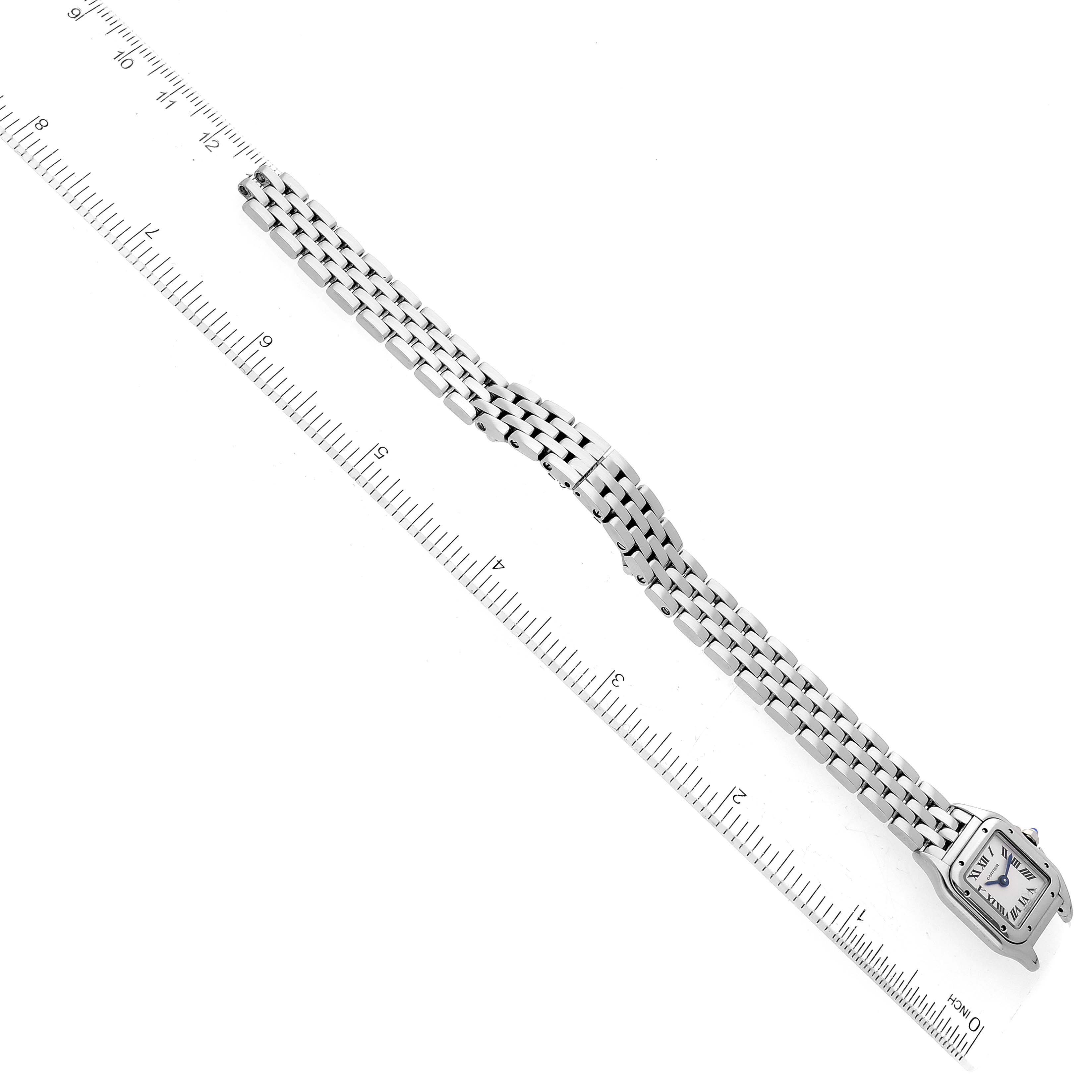 The image shows a top-down view of a Cartier Panthere WSPN0019 Women
s Stainless Steel Silver Dial WSPN0019 Women
s Stainless Steel Silver Dial watch with a ruler for scale.