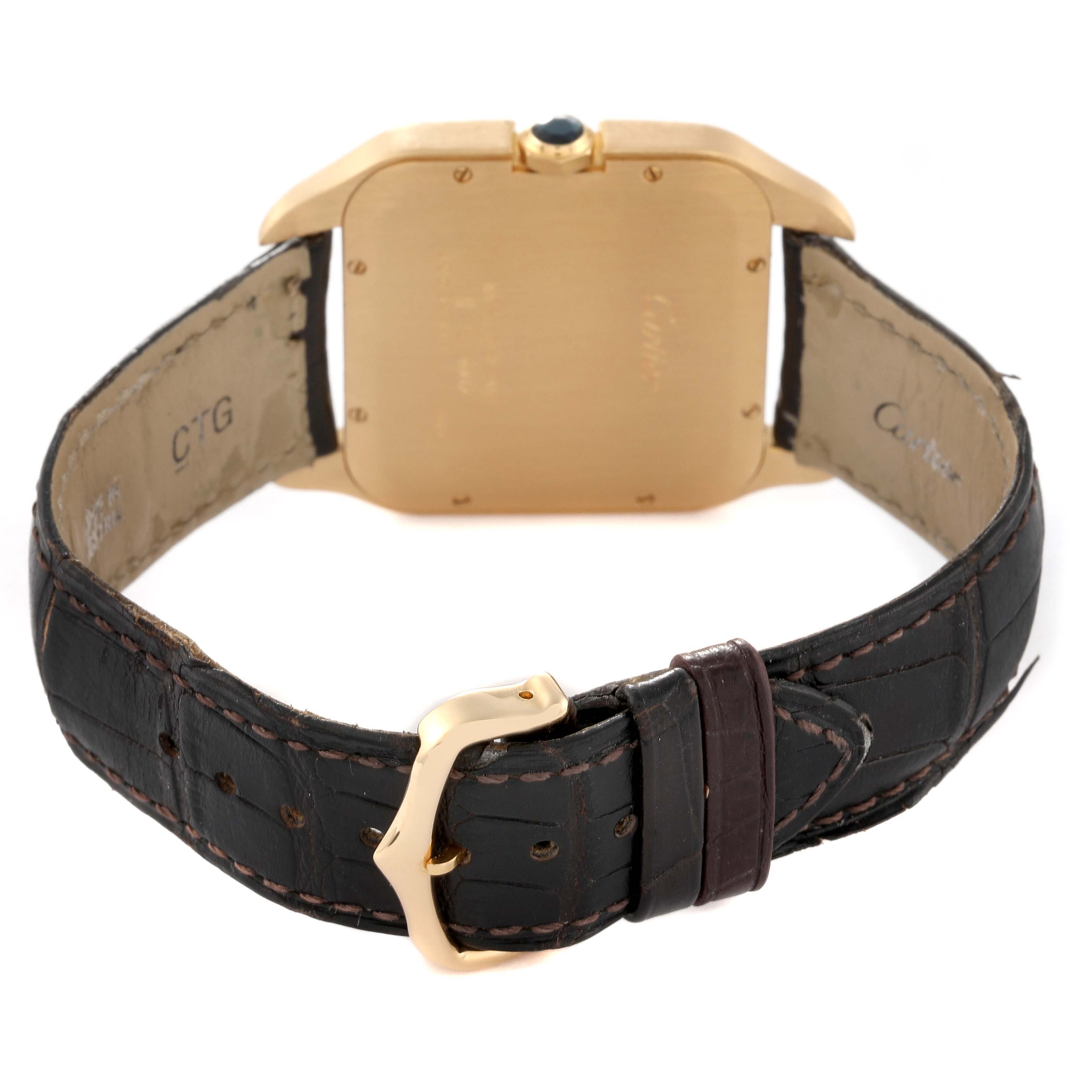 The image shows the back view of a Santos Dumont watch by Cartier, featuring the case back and leather strap with buckle.
