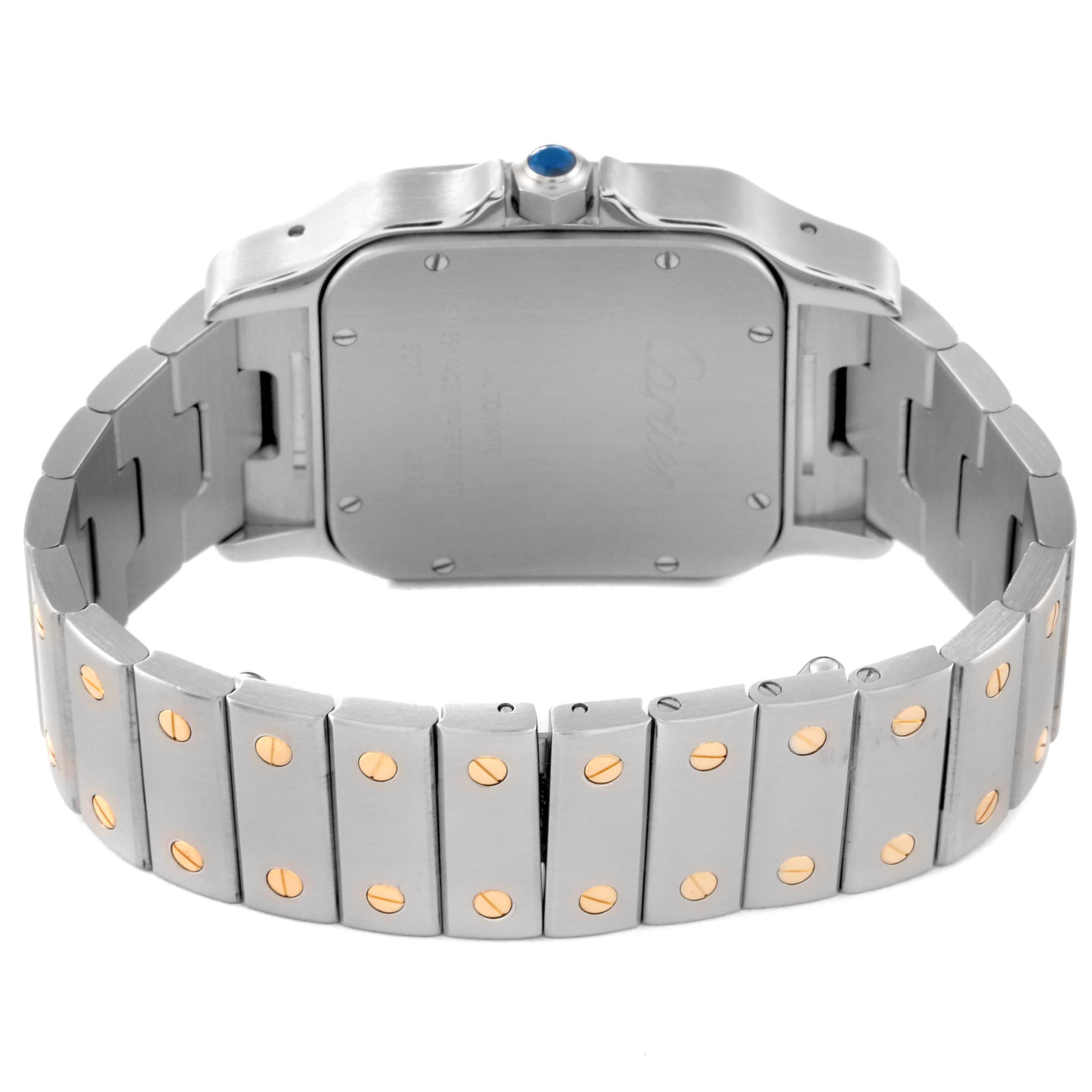 This image shows the back view of a Cartier Santos W20099C4 Men
s Steel and Gold (two tone) Silver Dial W20099C4 Men
s Steel and Gold (two tone) Silver Dial watch, highlighting its metal bracelet with gold screw accents.