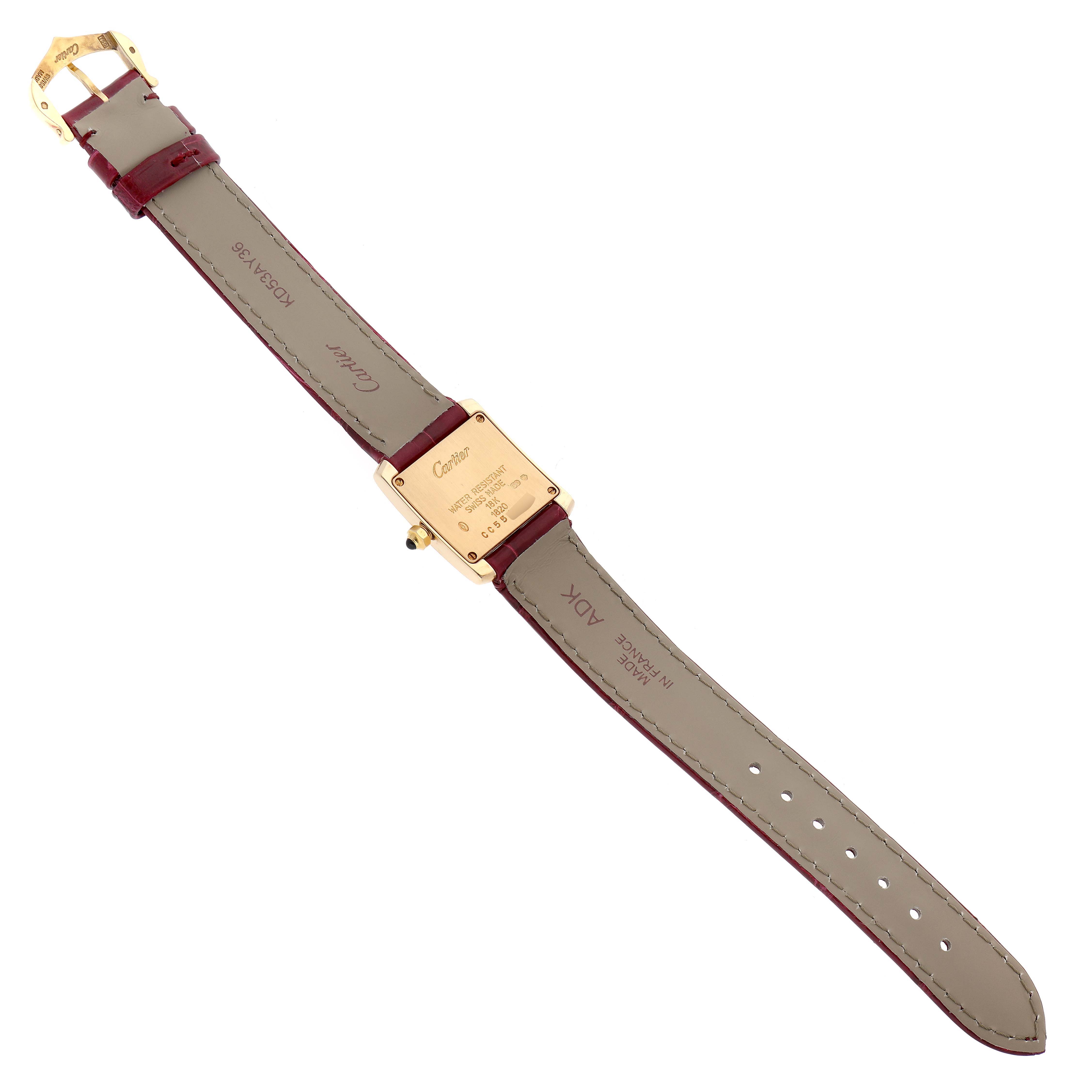 This image shows the back view of a Cartier Tank Française watch, detailing the case back and leather straps.