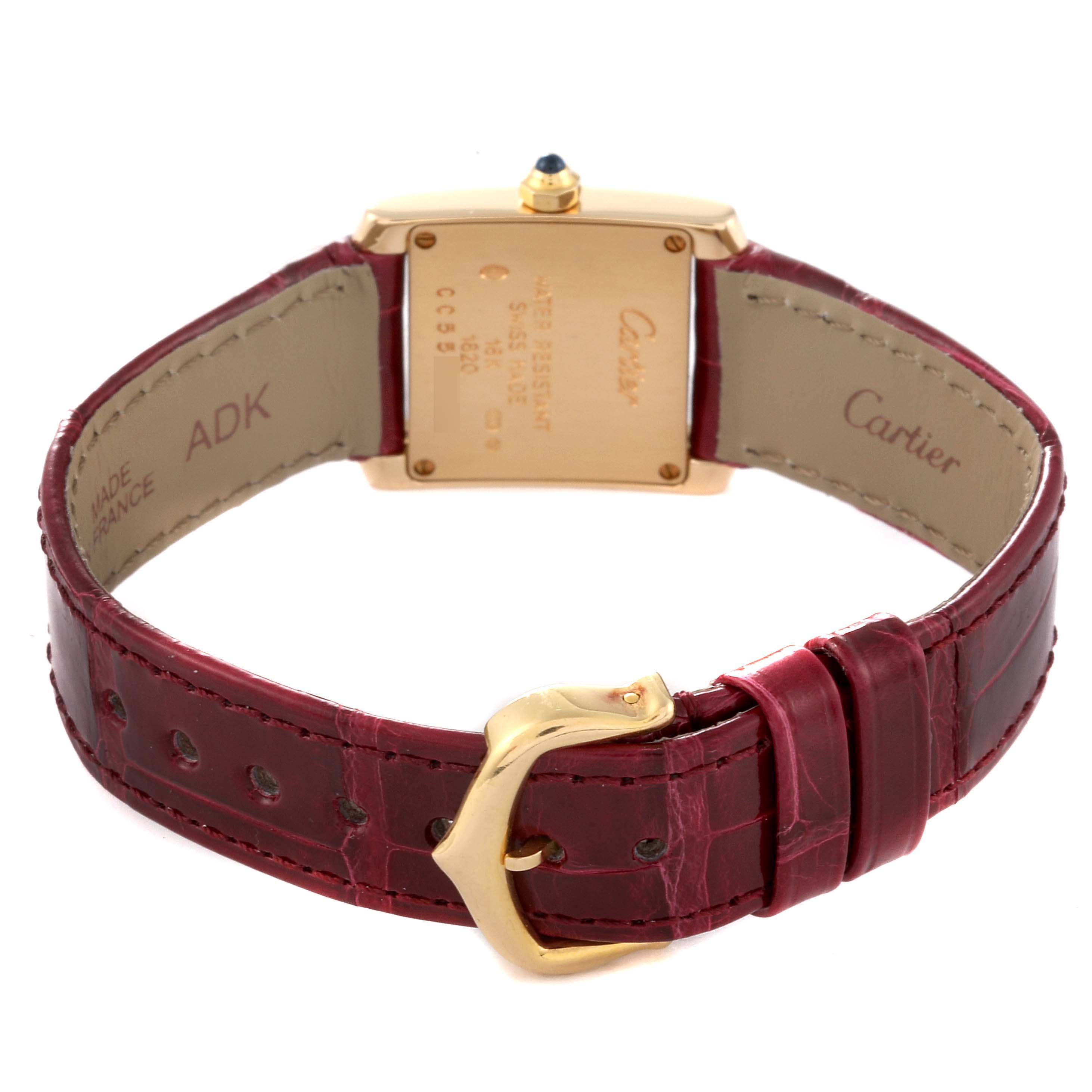 This image shows the back view of a Cartier Tank Francaise W5000256 Women's Yellow Gold Silver Dial W5000256 Women's Yellow Gold Silver Dial watch, displaying the strap, buckle, and case back.