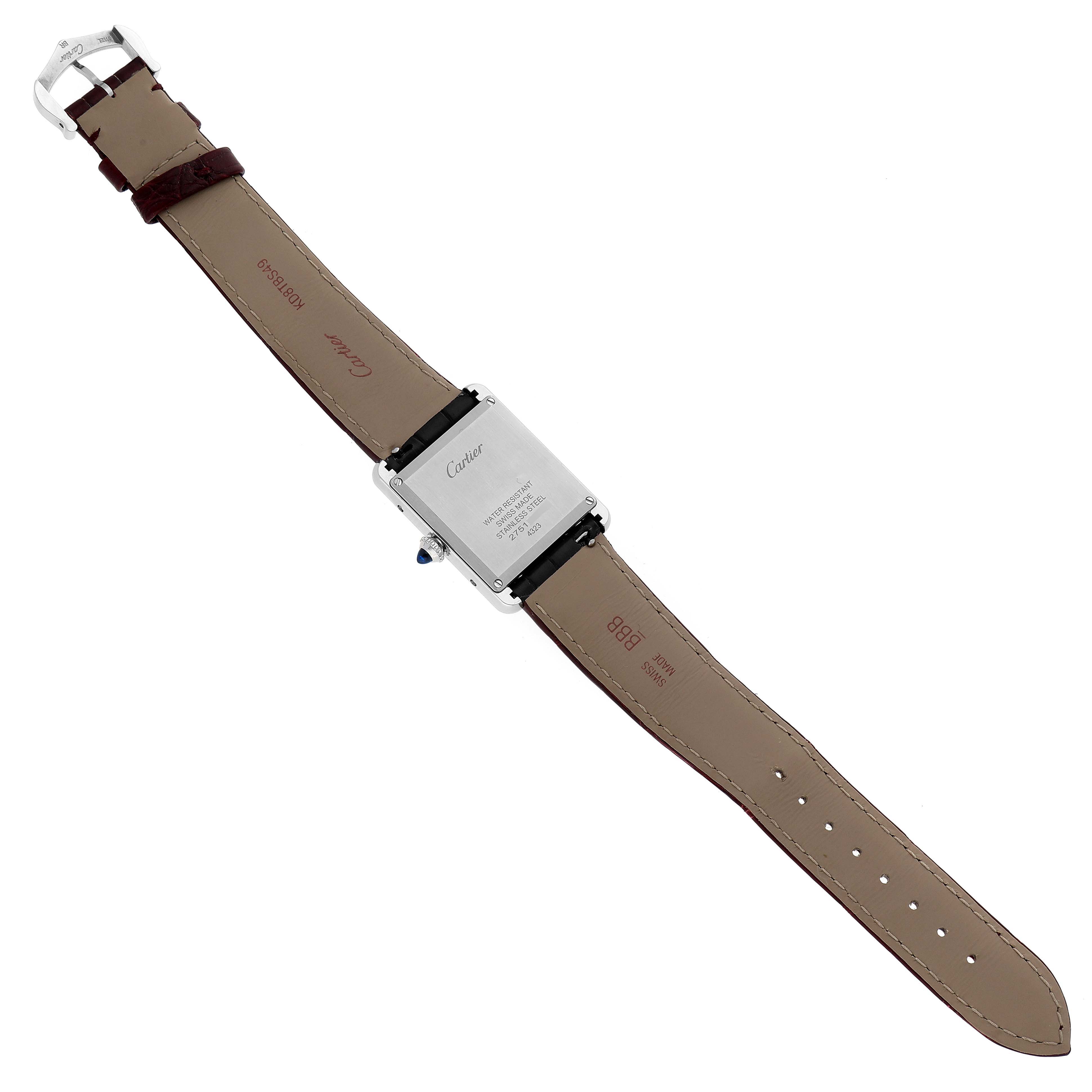 The image shows the back and strap of a Cartier Tank Must WSTA0054 Women's Stainless Steel Red Dial WSTA0054 Women's Stainless Steel Red Dial watch, focusing on the case back, buckle, and leather strap.