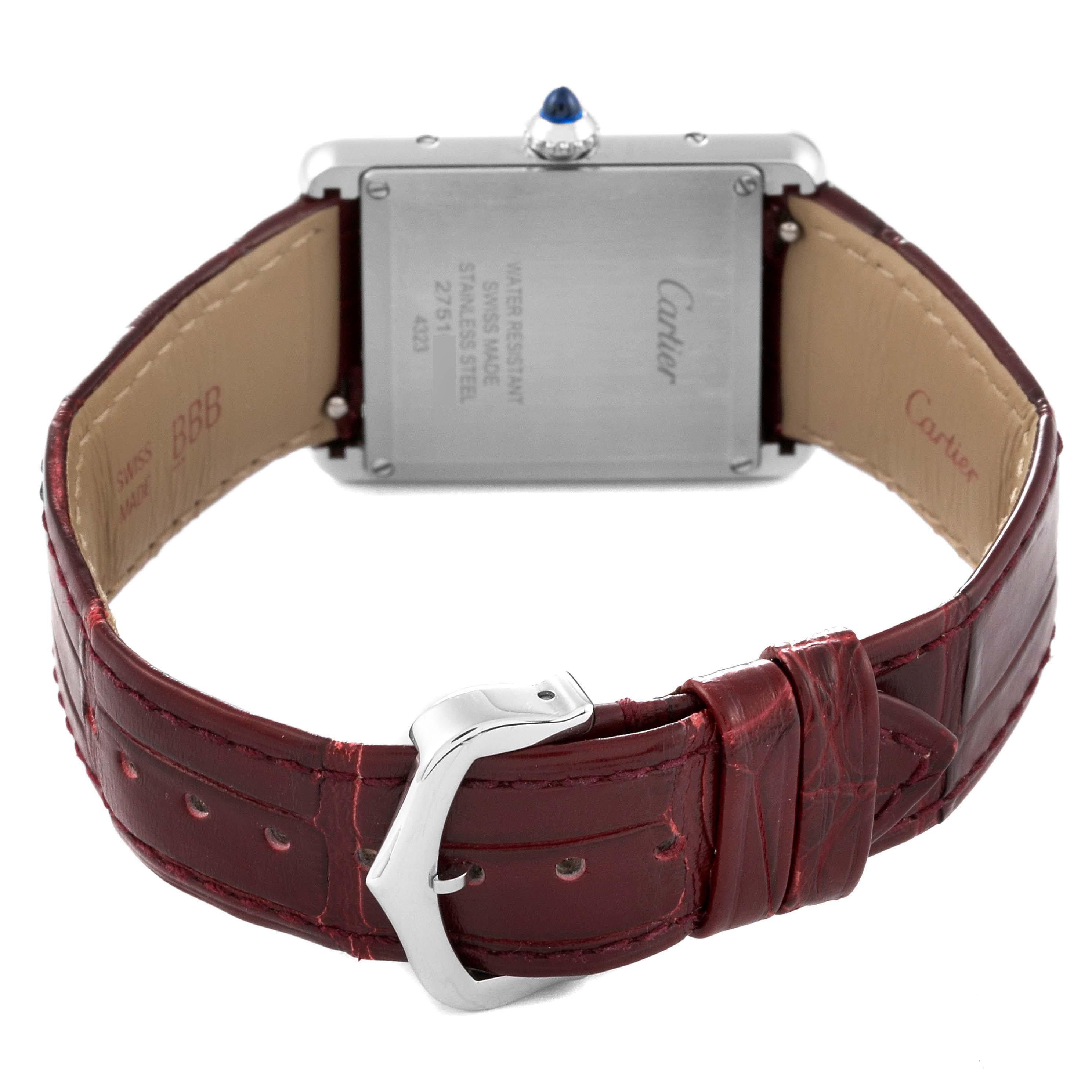 This image shows the back side of the Cartier Tank Must WSTA0054 Women's Stainless Steel Red Dial WSTA0054 Women's Stainless Steel Red Dial watch, featuring its rectangular case and red leather strap.