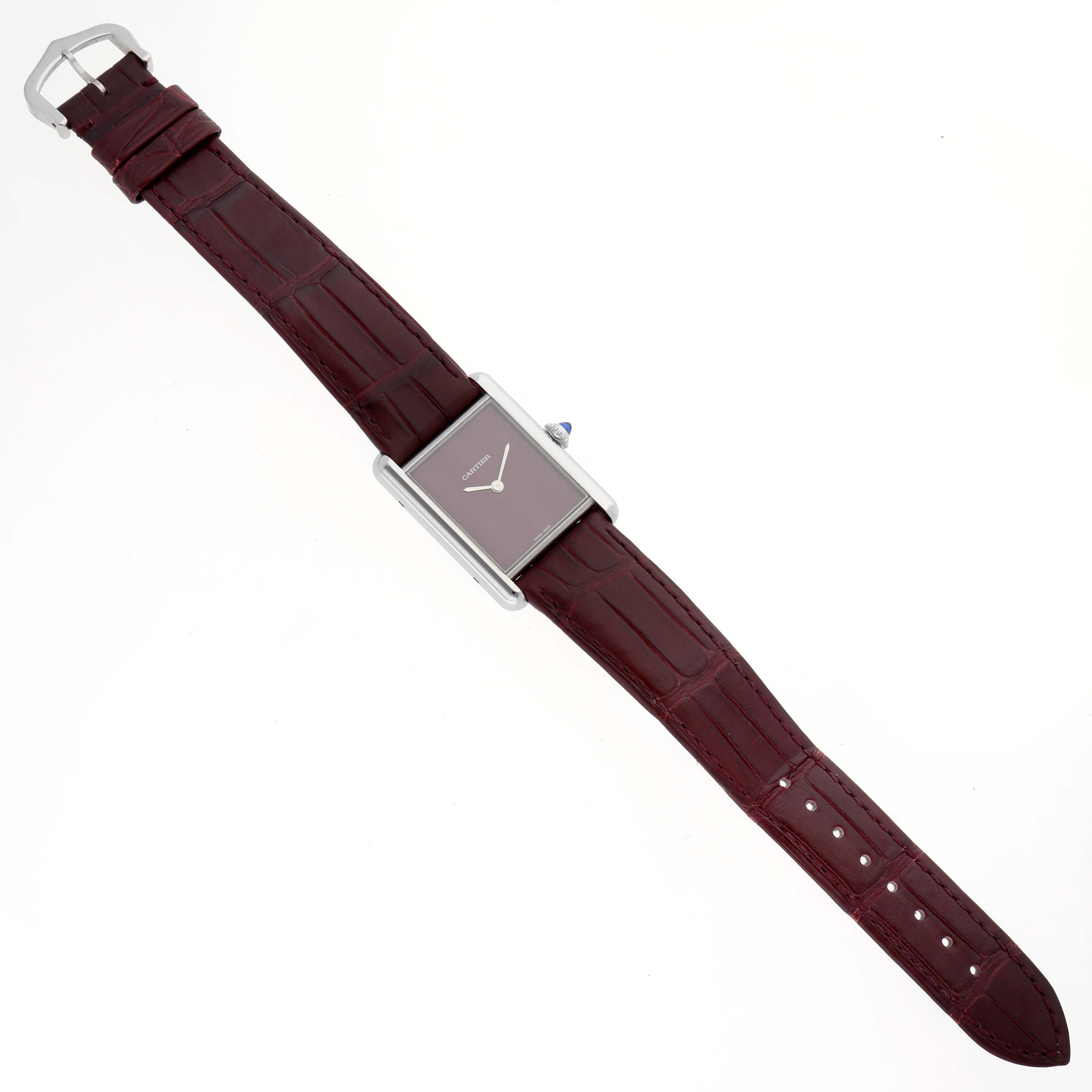 The image shows a top view of the Cartier Tank Must WSTA0054 Women's Stainless Steel Red Dial WSTA0054 Women's Stainless Steel Red Dial model, displaying the entire watch and strap.