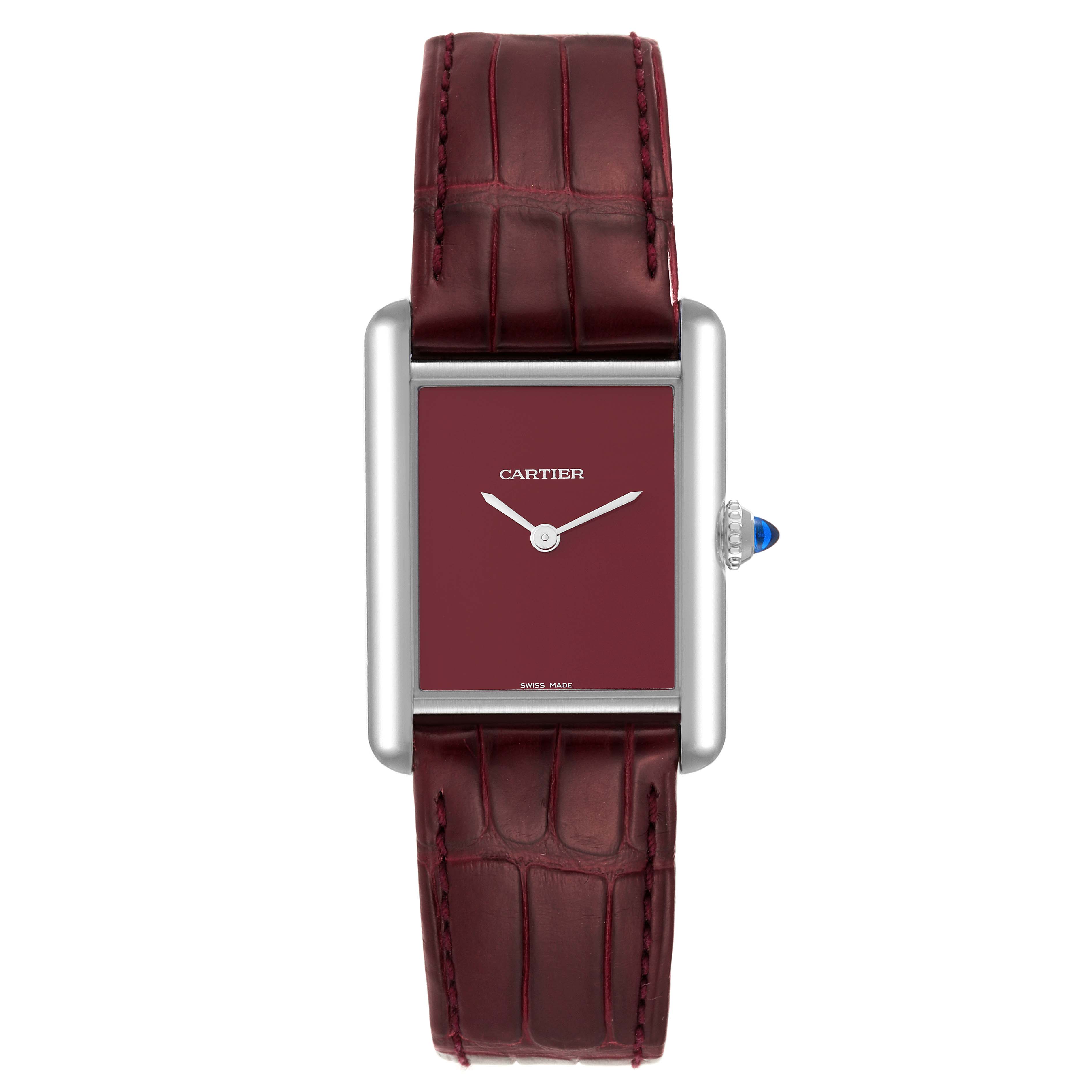 The image shows the front view of a Cartier Tank Must WSTA0054 Women's Stainless Steel Red Dial WSTA0054 Women's Stainless Steel Red Dial model watch with a maroon dial and strap.