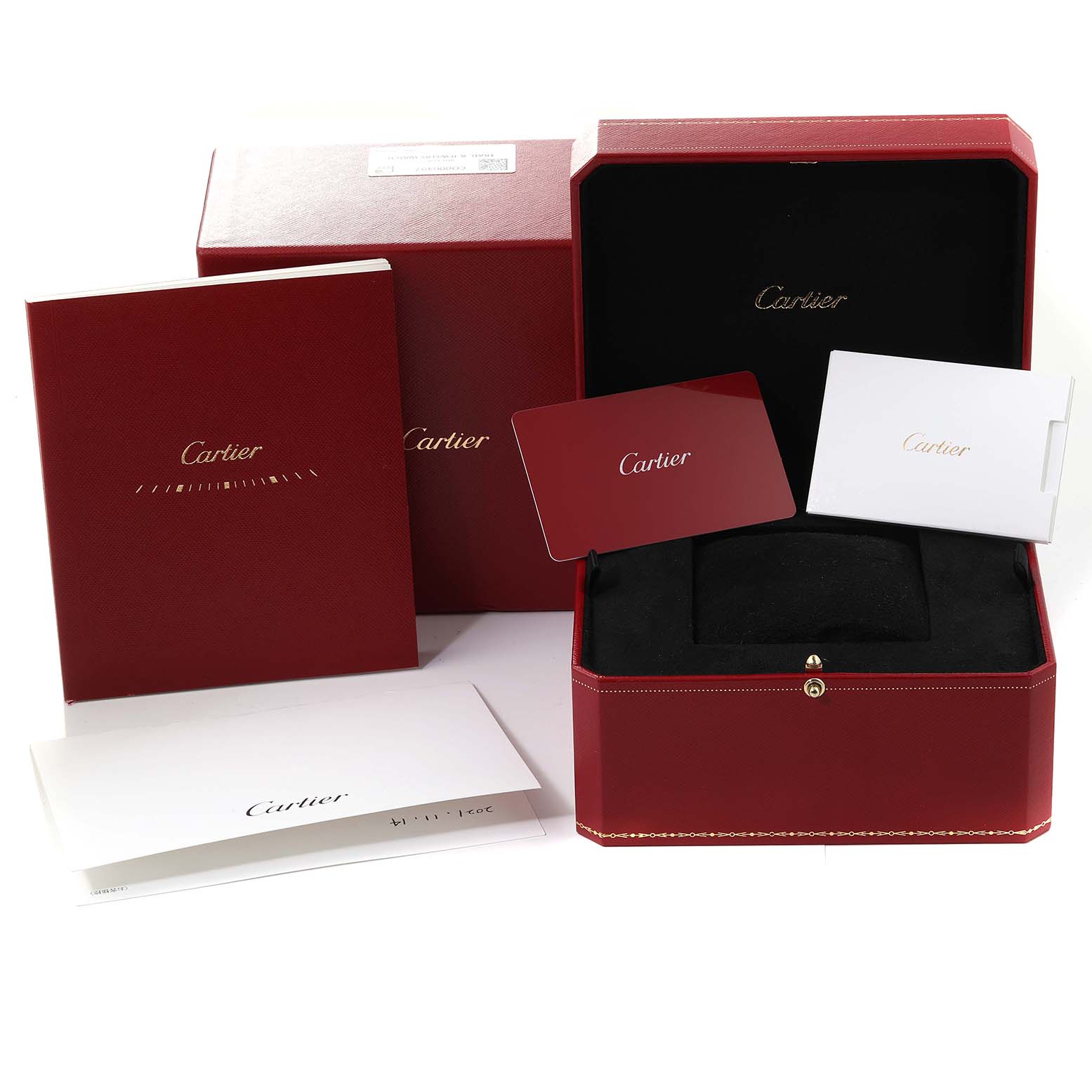 The image shows the packaging and accessories for a Cartier Tank Must WSTA0054 Women's Stainless Steel Red Dial WSTA0054 Women's Stainless Steel Red Dial watch, including boxes, documentation, and cards.