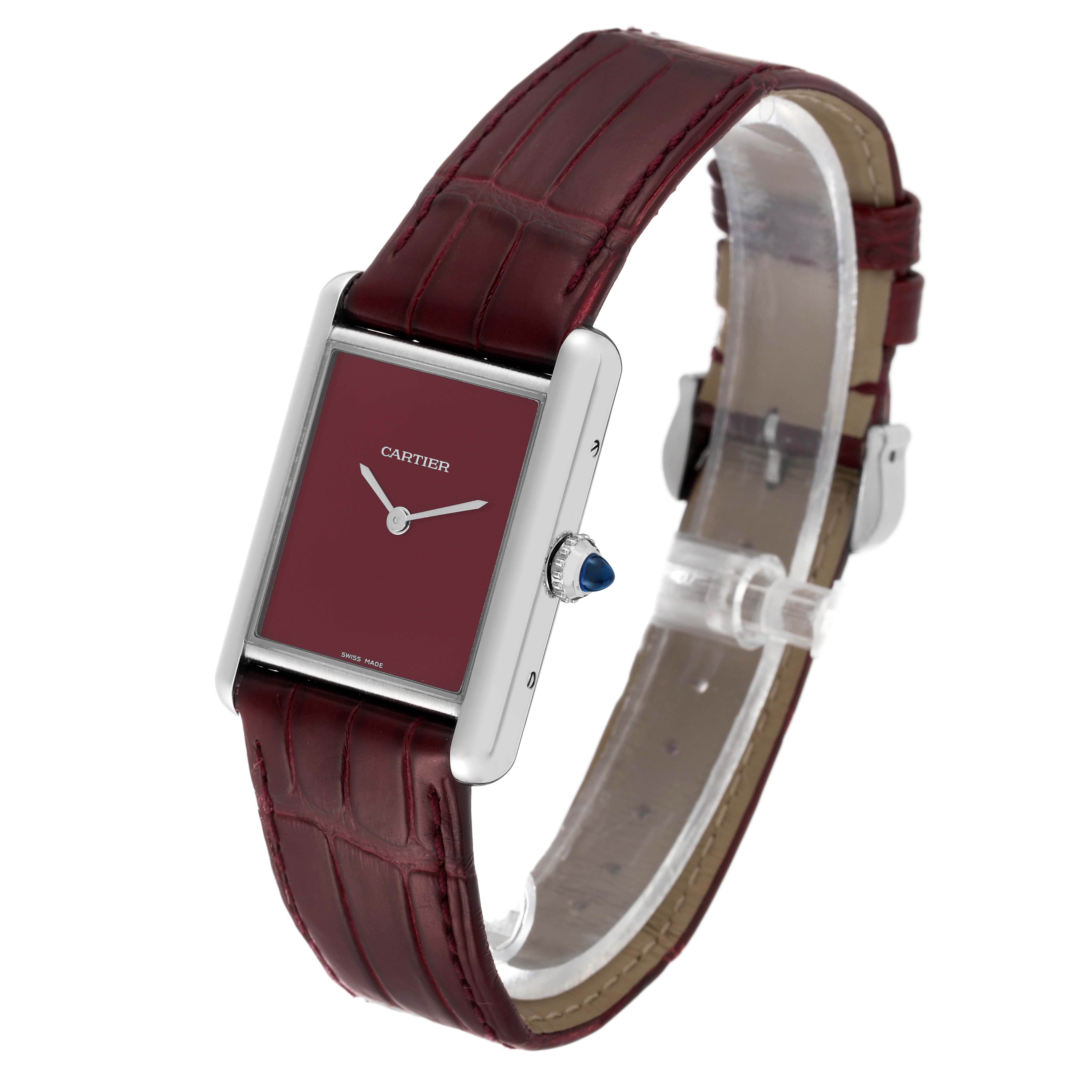 This image shows a Cartier Tank Must WSTA0054 Women's Stainless Steel Red Dial WSTA0054 Women's Stainless Steel Red Dial watch from a three-quarter angle, highlighting its burgundy dial and leather strap.