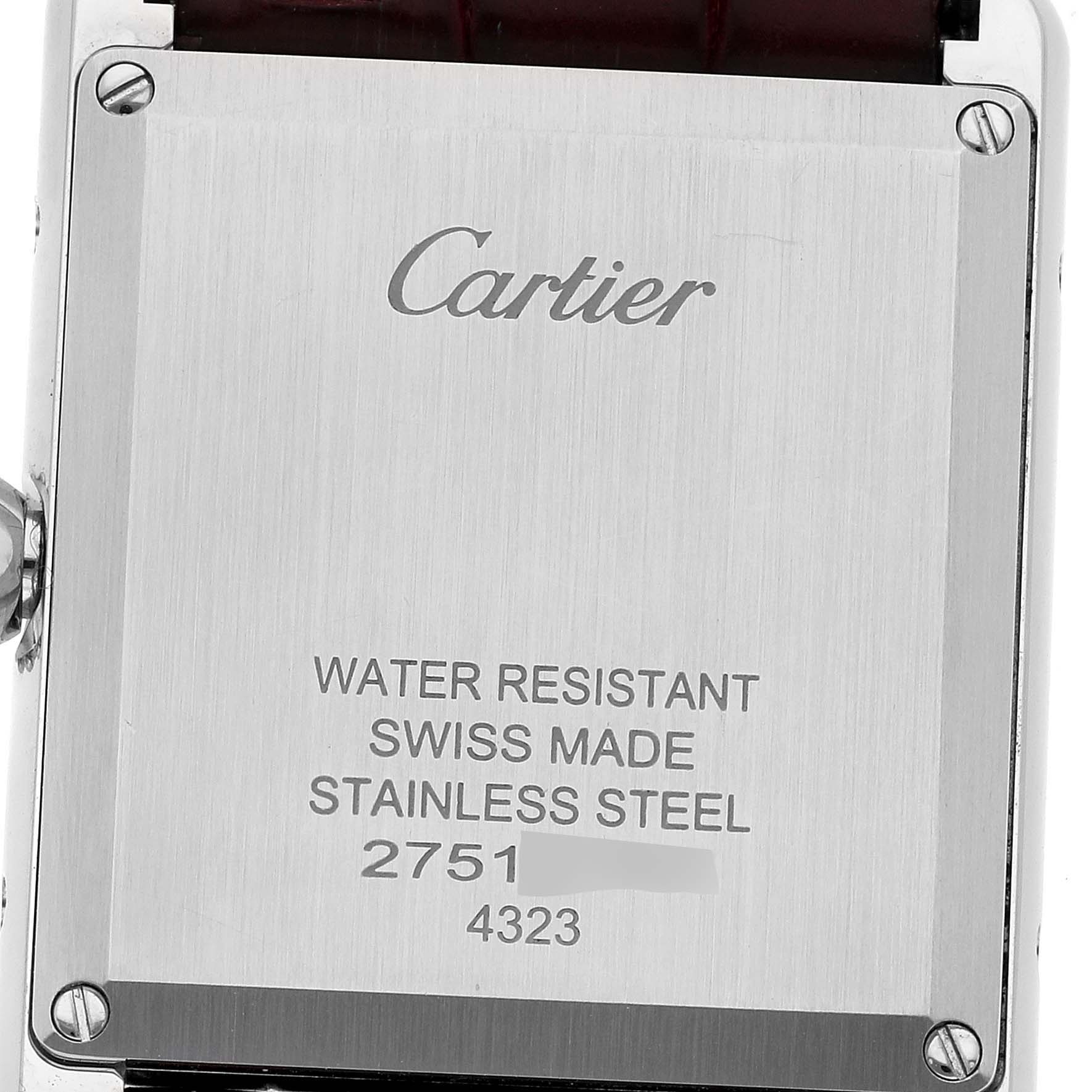 This image shows the back case of the Cartier Tank Must WSTA0054 Women's Stainless Steel Red Dial WSTA0054 Women's Stainless Steel Red Dial watch, displaying its material and water resistance details.