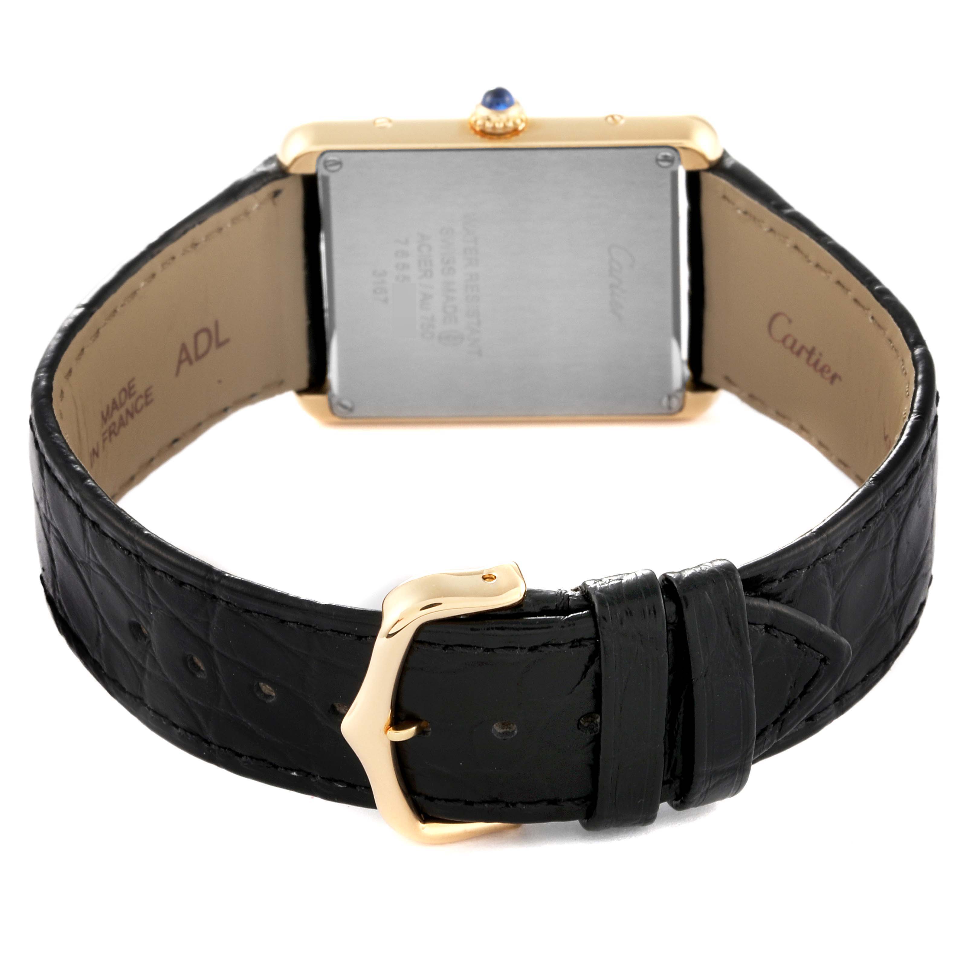 The image shows the back view of the Tank Solo model by Cartier, highlighting the leather strap and clasp.