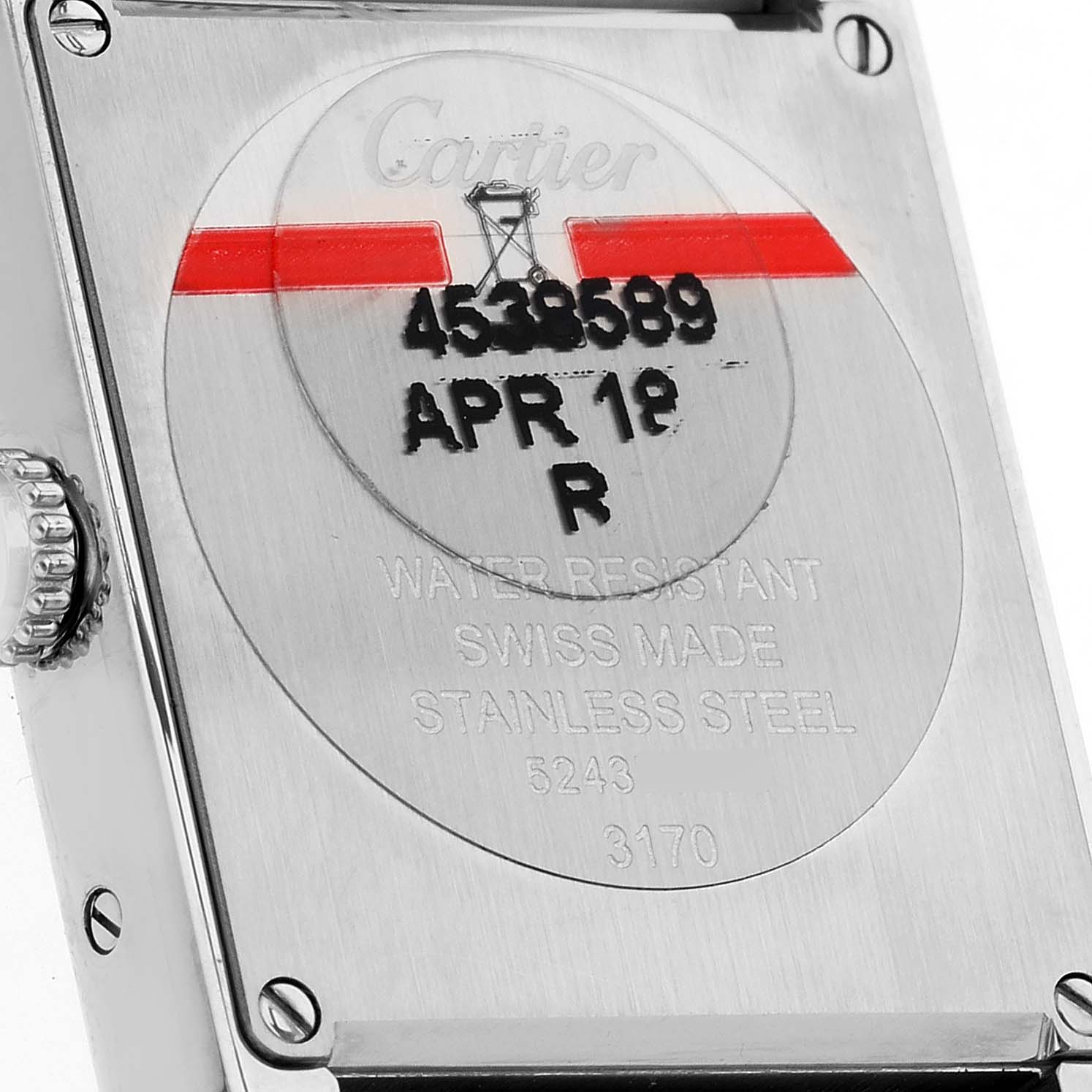 The image shows the back case of a Cartier Tank Solo W5200013 Women
s Stainless Steel Silver Dial W5200013 Women
s Stainless Steel Silver Dial watch, highlighting the inscriptions and water resistance details.