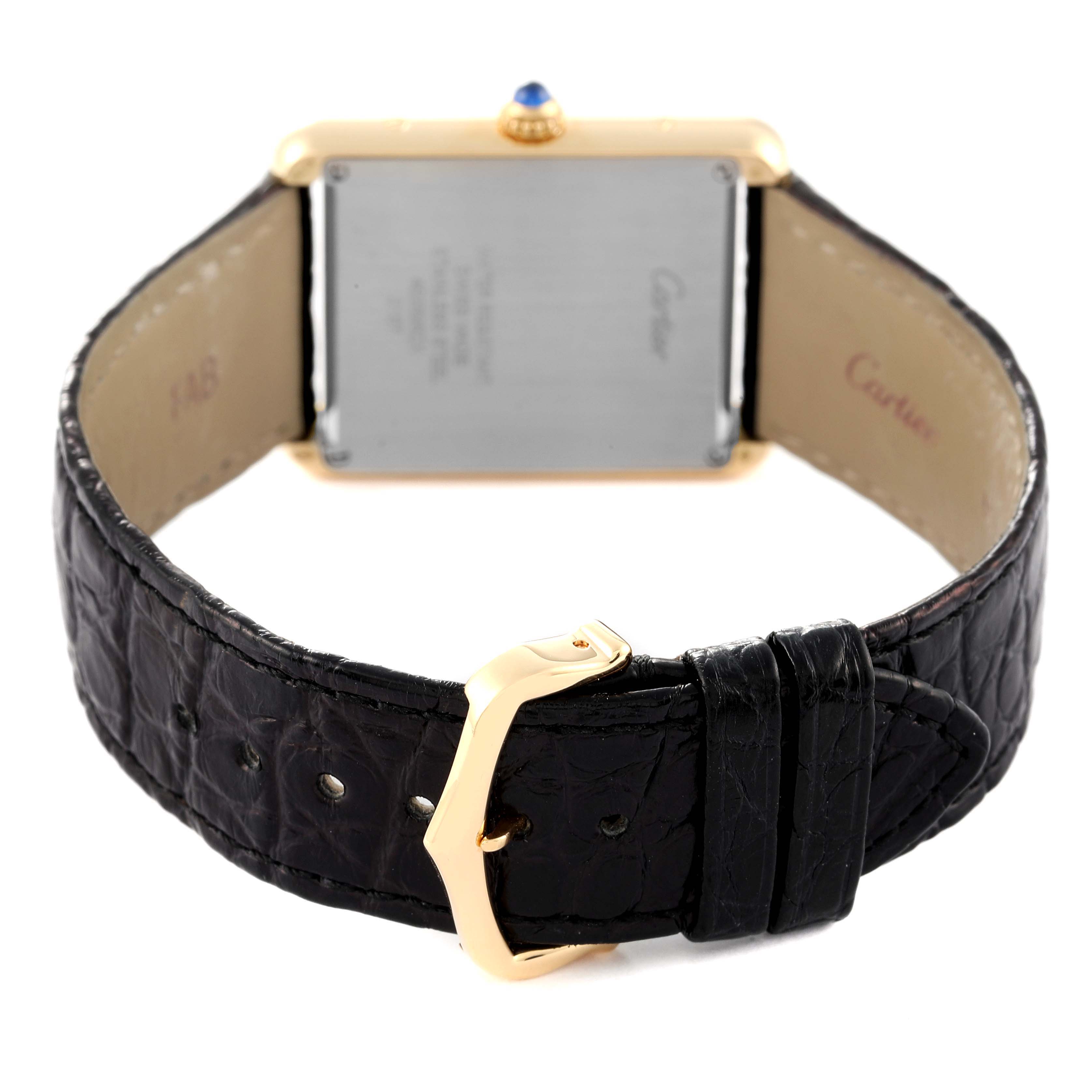 The image shows the back of a Cartier Tank Solo W5200004 Men's Yellow Gold Silver Dial W5200004 Men's Yellow Gold Silver Dial watch, highlighting the strap and buckle.