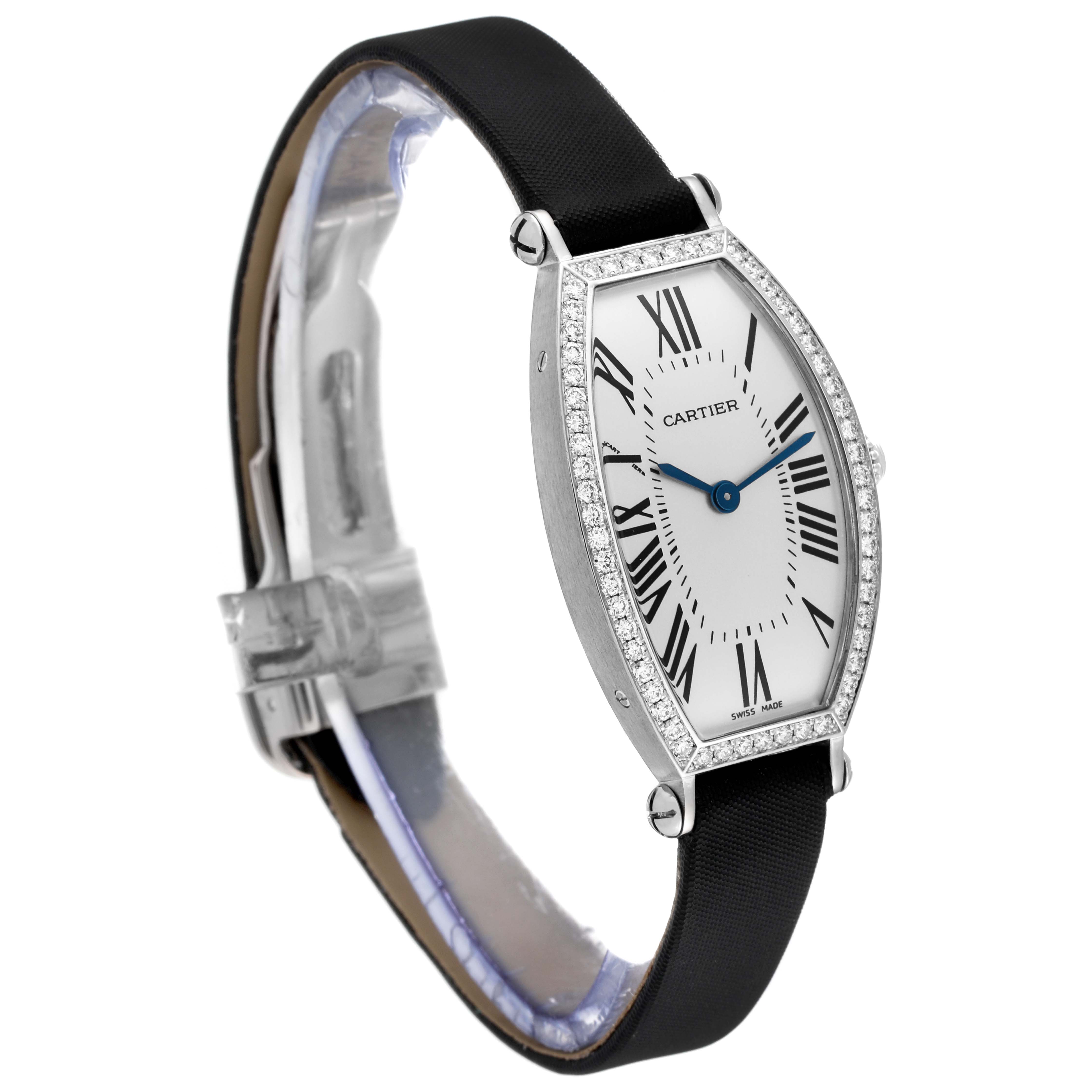 The image shows a side view of the Cartier Tonneau WE400131 Women
s White Gold Silver Dial WE400131 Women
s White Gold Silver Dial model watch, detailing its elongated face, black strap, and diamond-set bezel.