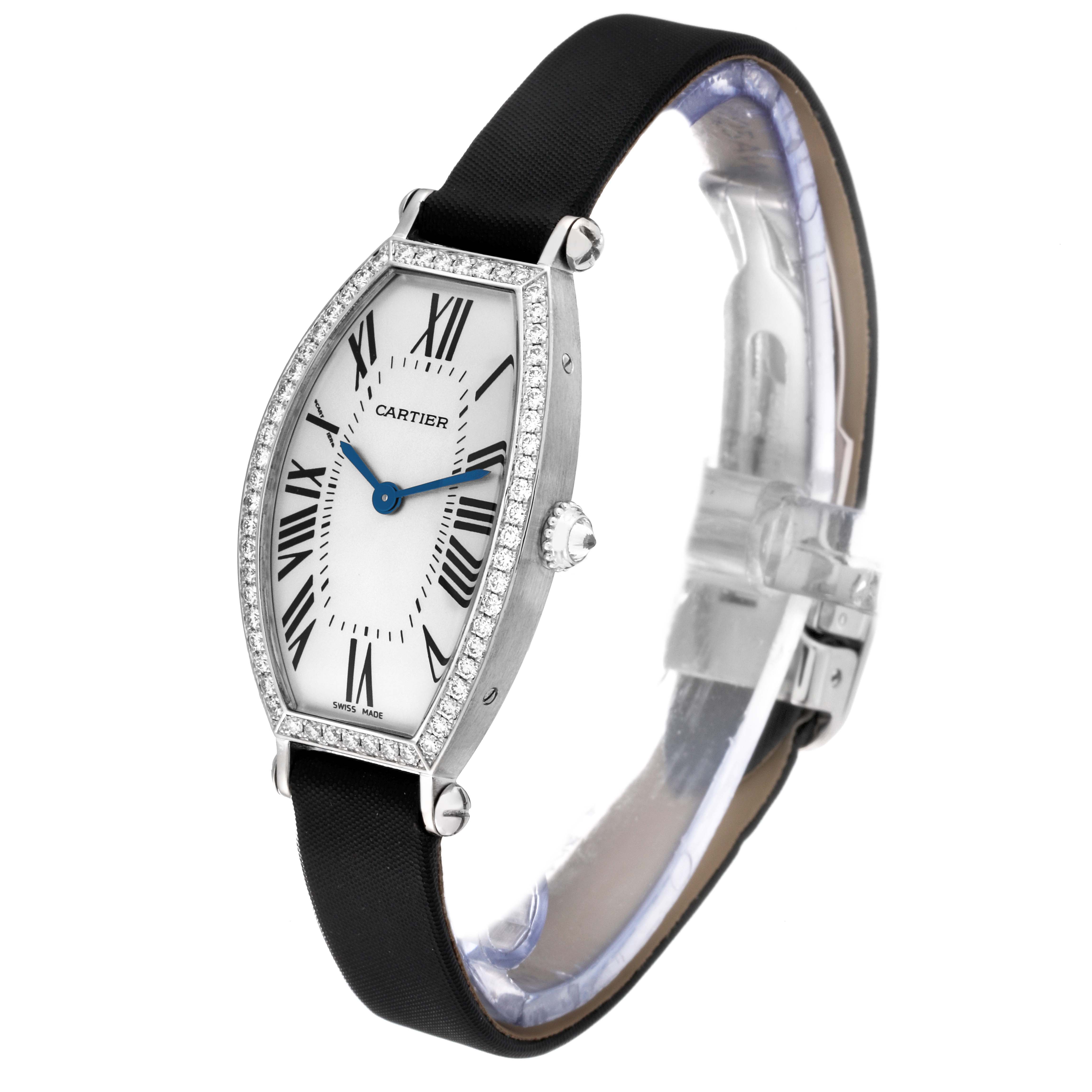 This image shows a Cartier Tonneau WE400131 Women
s White Gold Silver Dial WE400131 Women
s White Gold Silver Dial watch angled to display its face, crown, strap, and diamond-encrusted bezel.