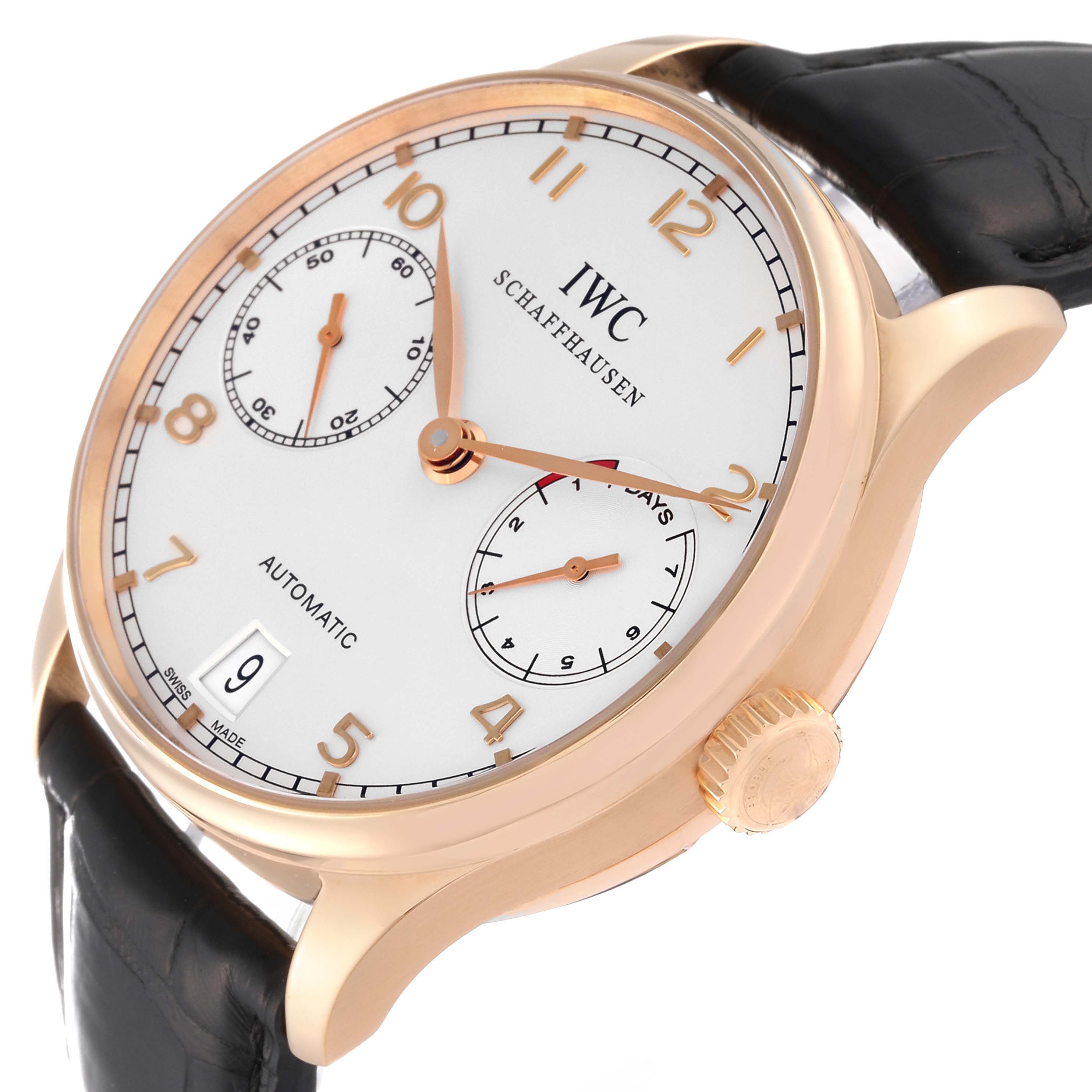 The IWC Portuguese IW500701 Men's Rose Gold Silver Dial IW500701 Men's Rose Gold Silver Dial model watch is shown at an angle, highlighting its face, crown, and black leather strap.