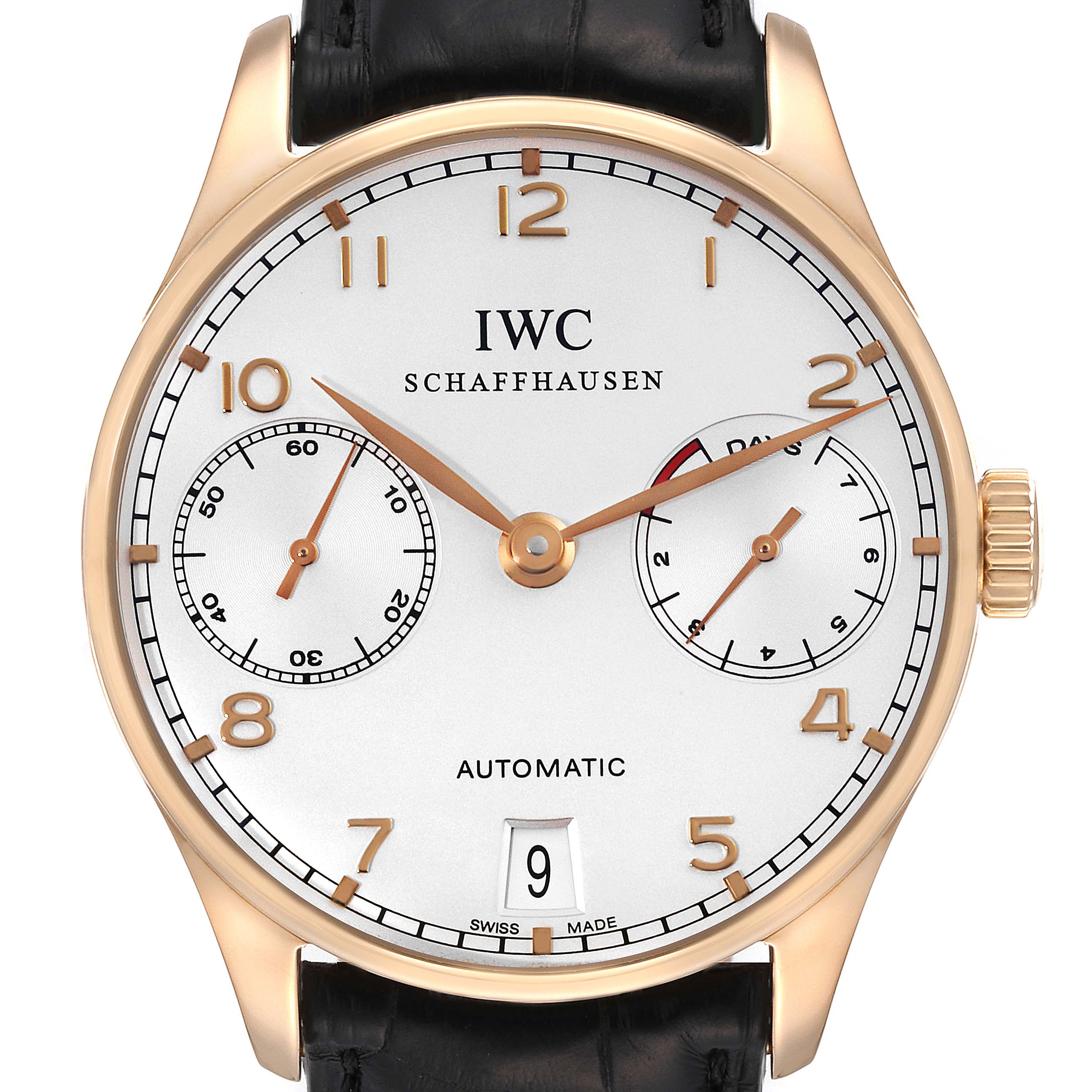 The image shows a front view of the IWC Portuguese IW500701 Men's Rose Gold Silver Dial IW500701 Men's Rose Gold Silver Dial automatic watch, featuring a gold case, white dial, black leather strap, and subdials.