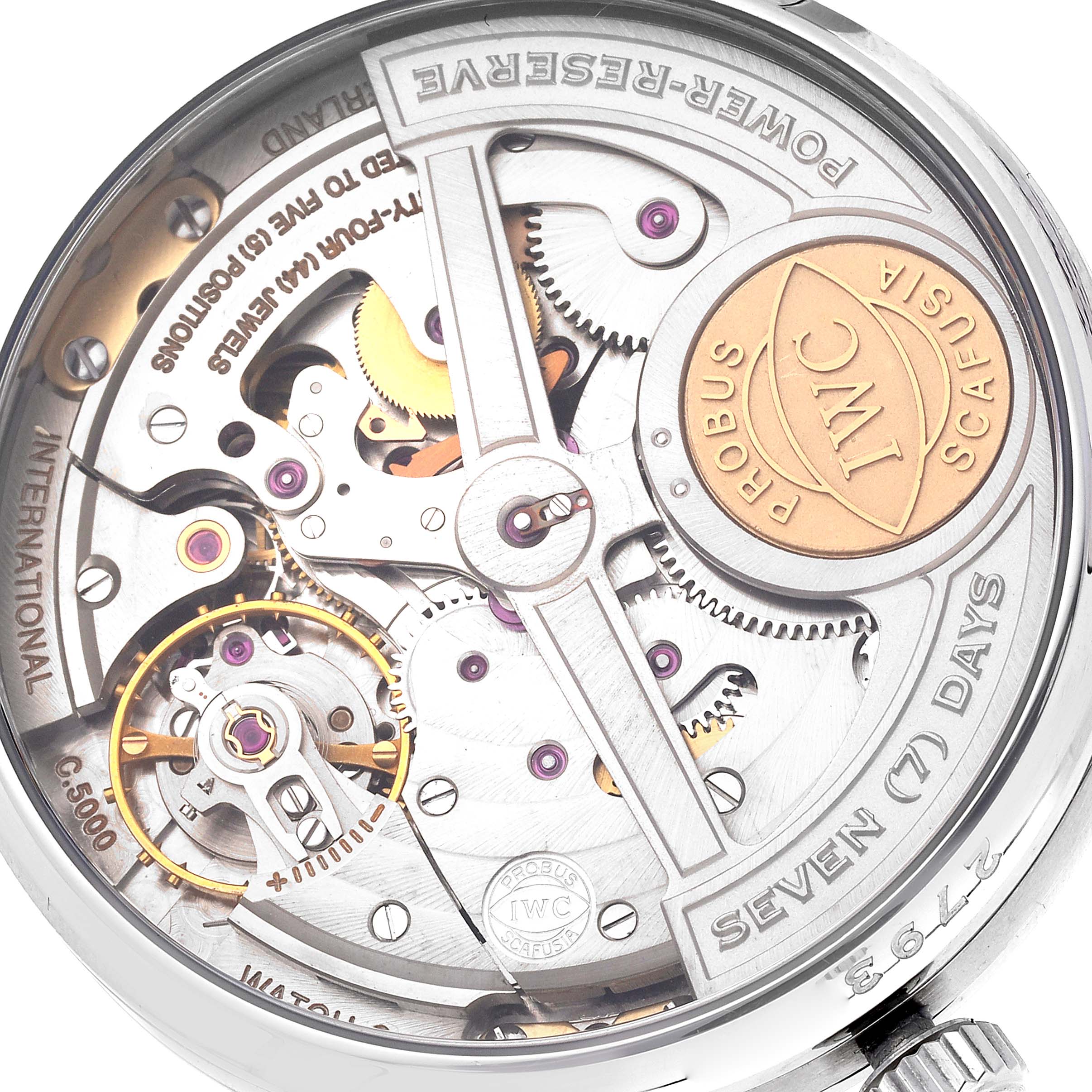 The image shows a close-up of the movement of an IWC Portuguese IW500001 Men's Stainless Steel Black Dial IW500001 Men's Stainless Steel Black Dial watch, highlighting the mechanism and power reserve indicator.