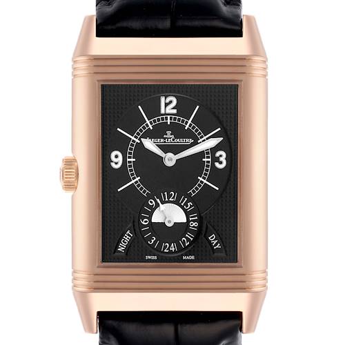 The image shows a front view of the Jaeger-LeCoultre Reverso watch, highlighting its face, hands, and day/night indicator.