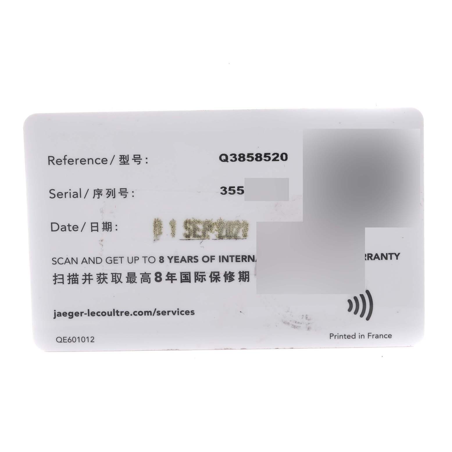 The image shows a warranty card for the Jaeger-LeCoultre Reverso watch model.